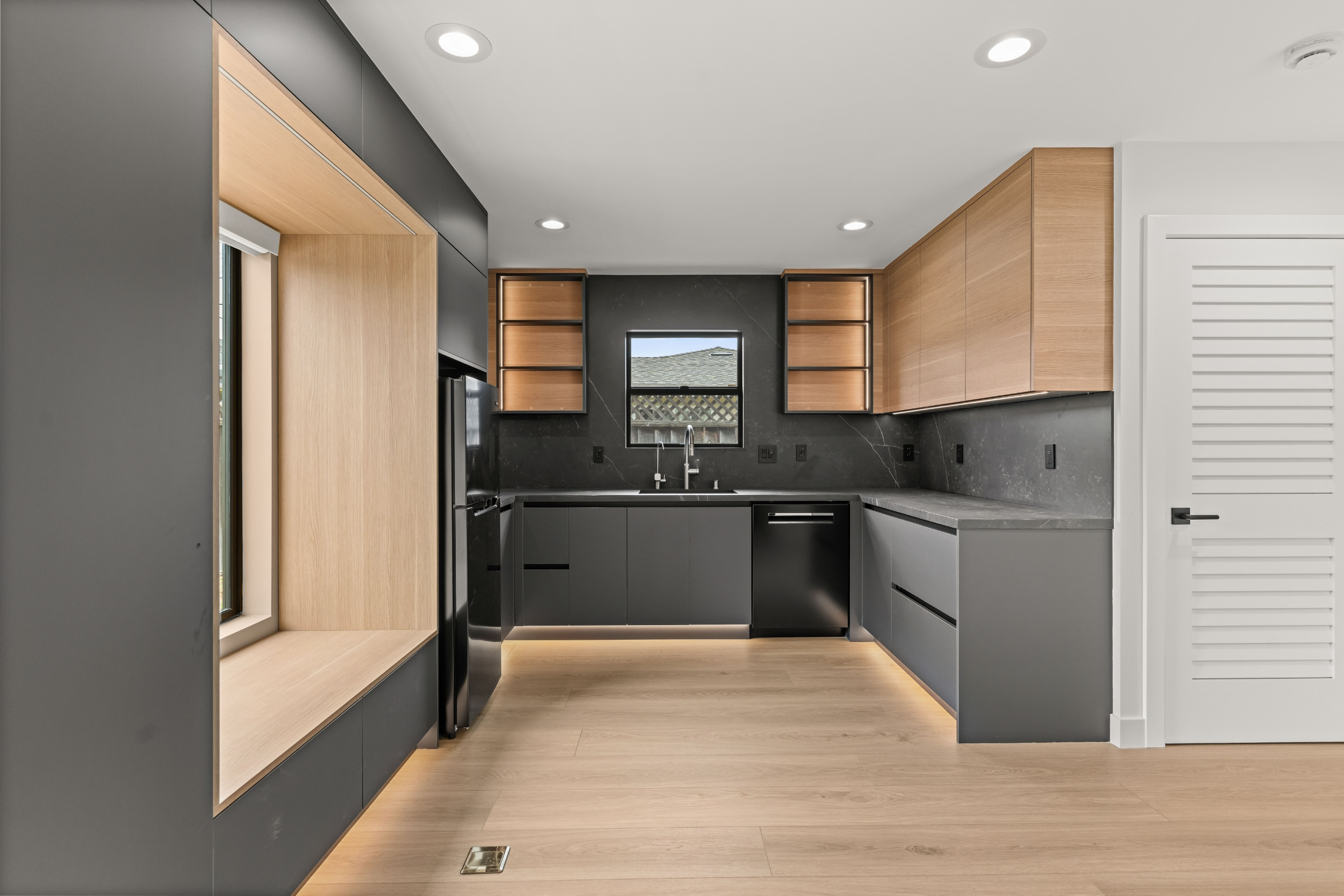 Custom Accessory Dwelling Unit kitchen in San Jose with sleek cabinetry, quartz surfaces, and built-in seating.