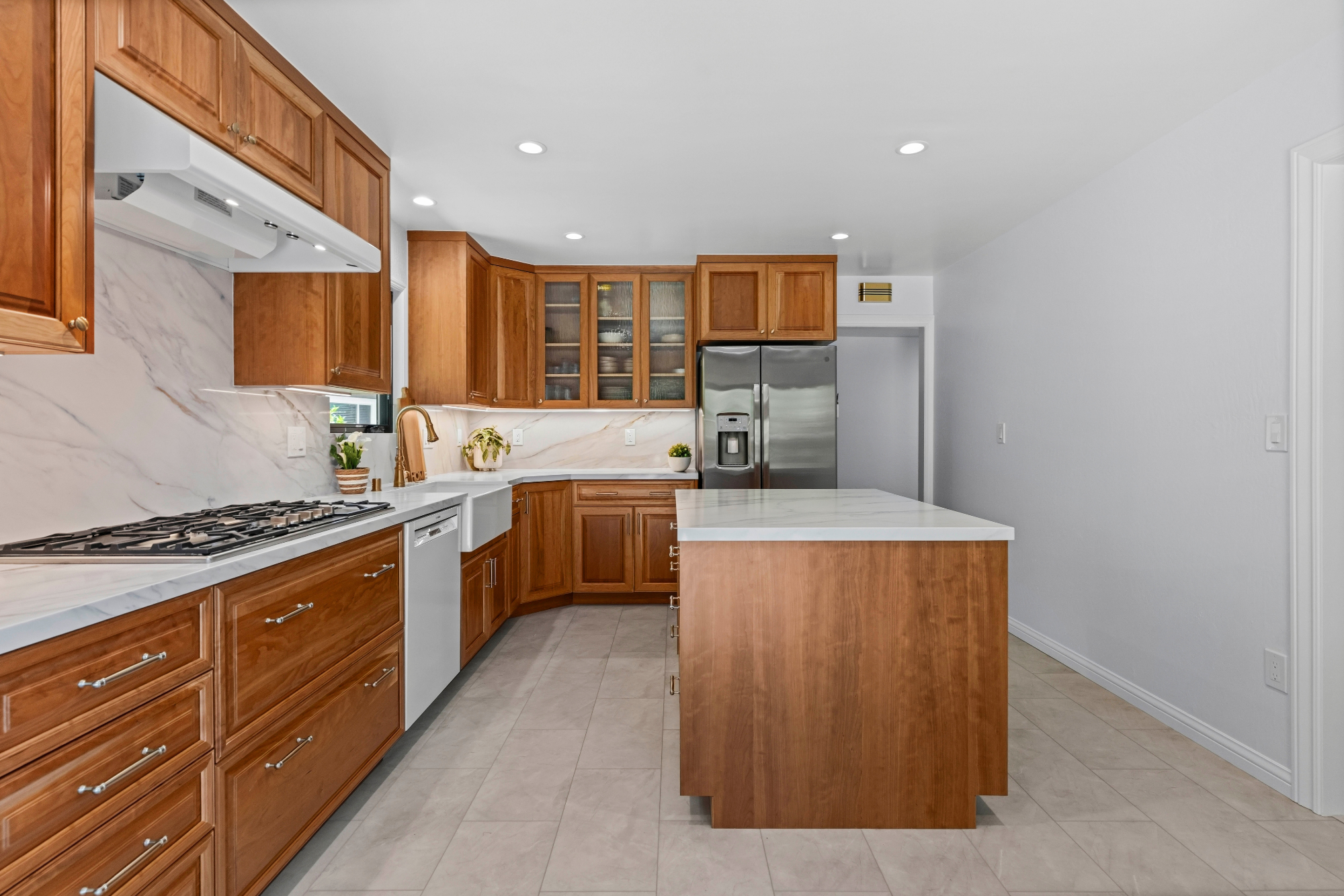 Custom kitchen addition in Los Gatos featuring handcrafted cabinetry, quartz countertops, and abundant storage.