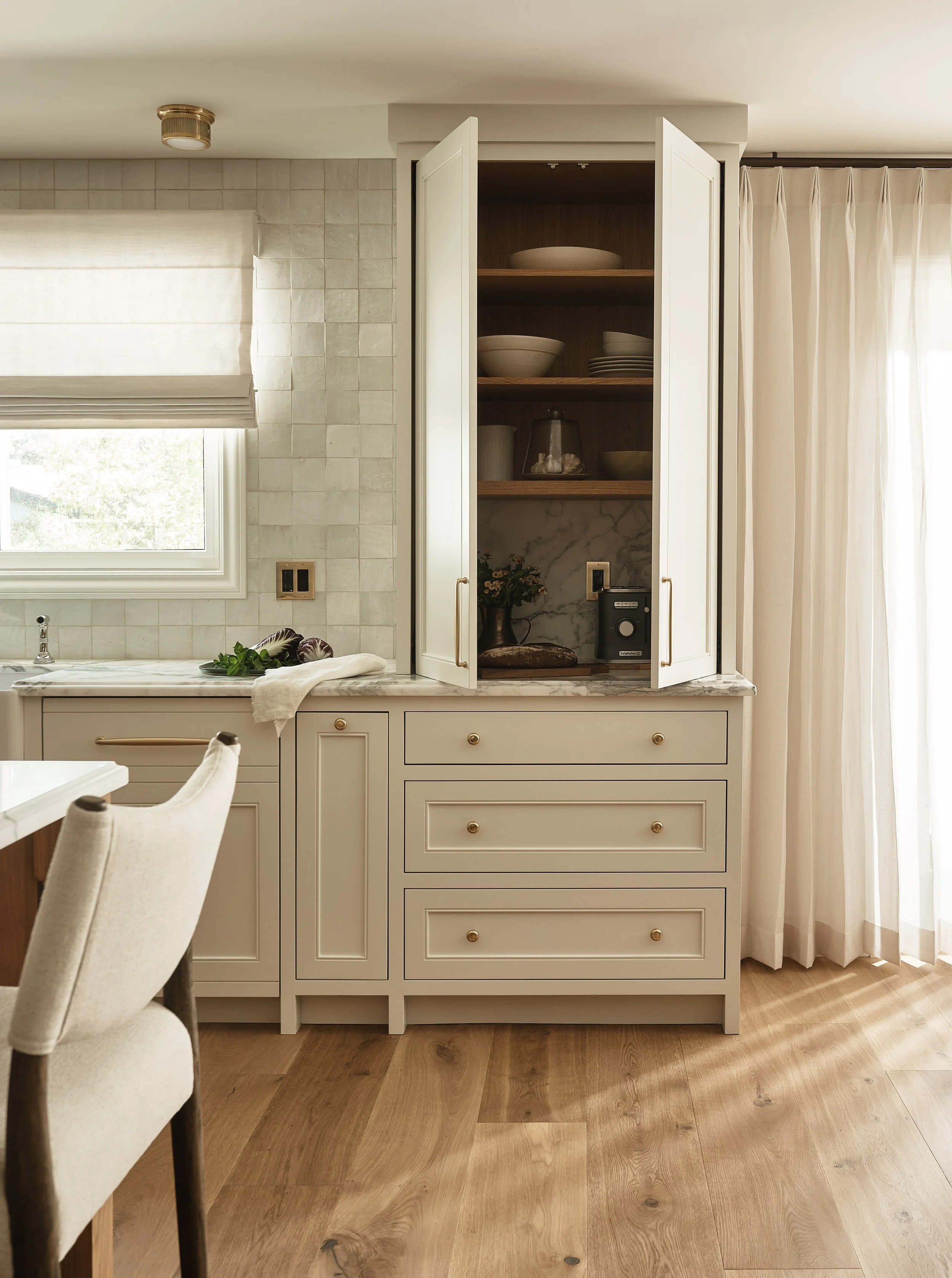 Custom cabinetry details and integrated storage solutions in this luxury Addition & Full Home Remodel.