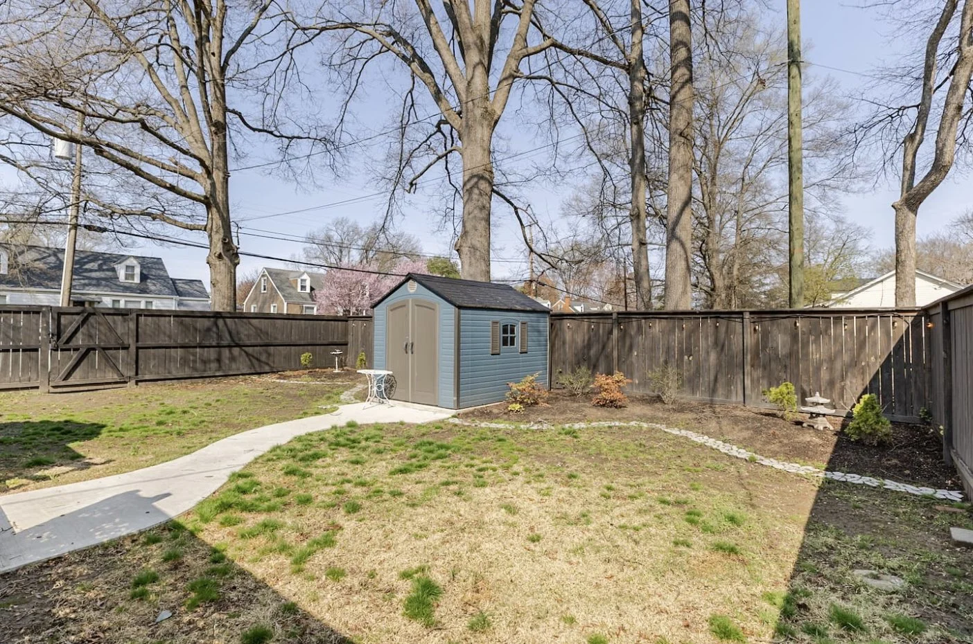 Spacious private backyard with charming shed, perfect for pets and kids.