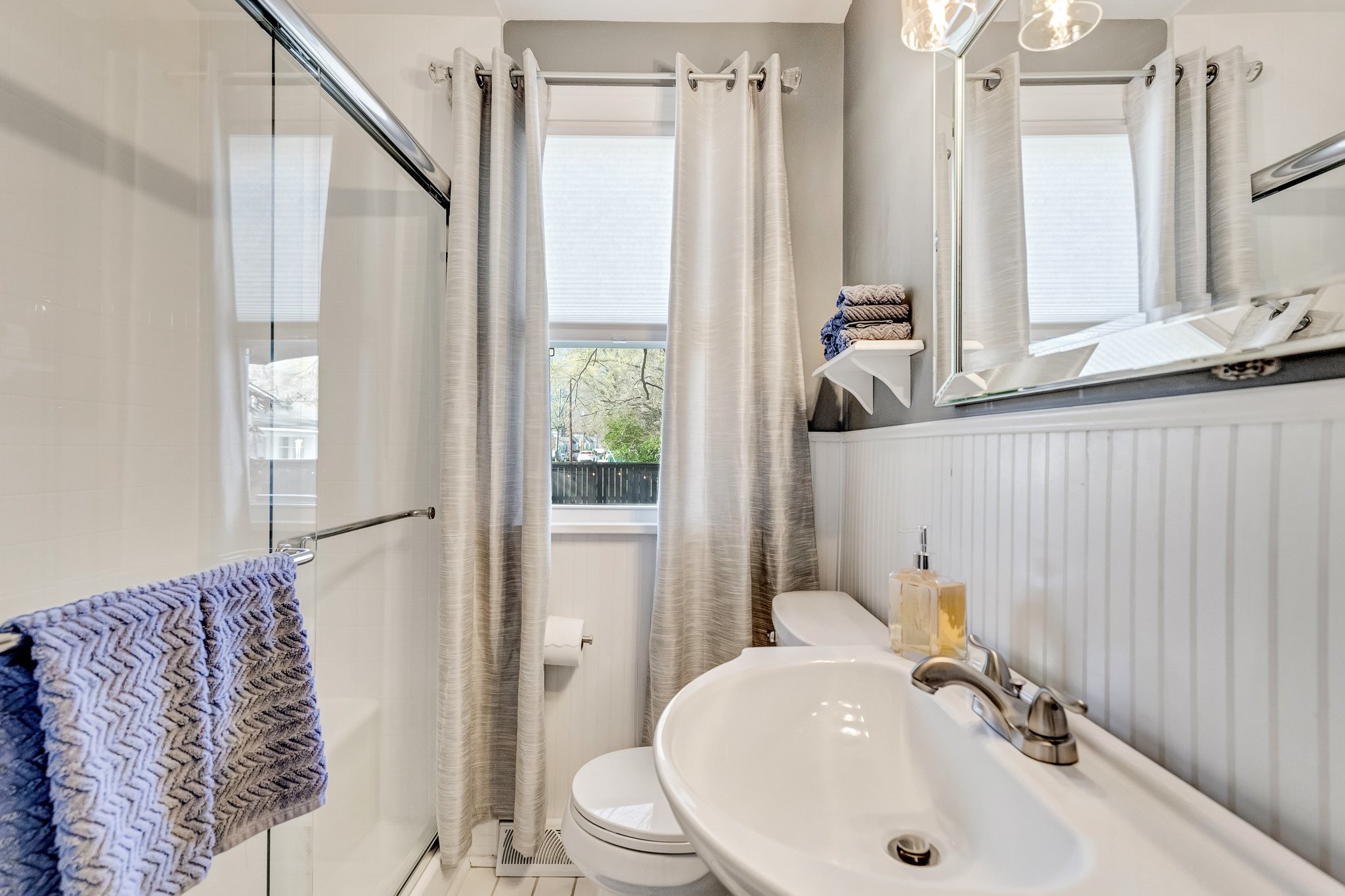 "Clean and stylish" with a walk-in shower and contemporary fixtures.