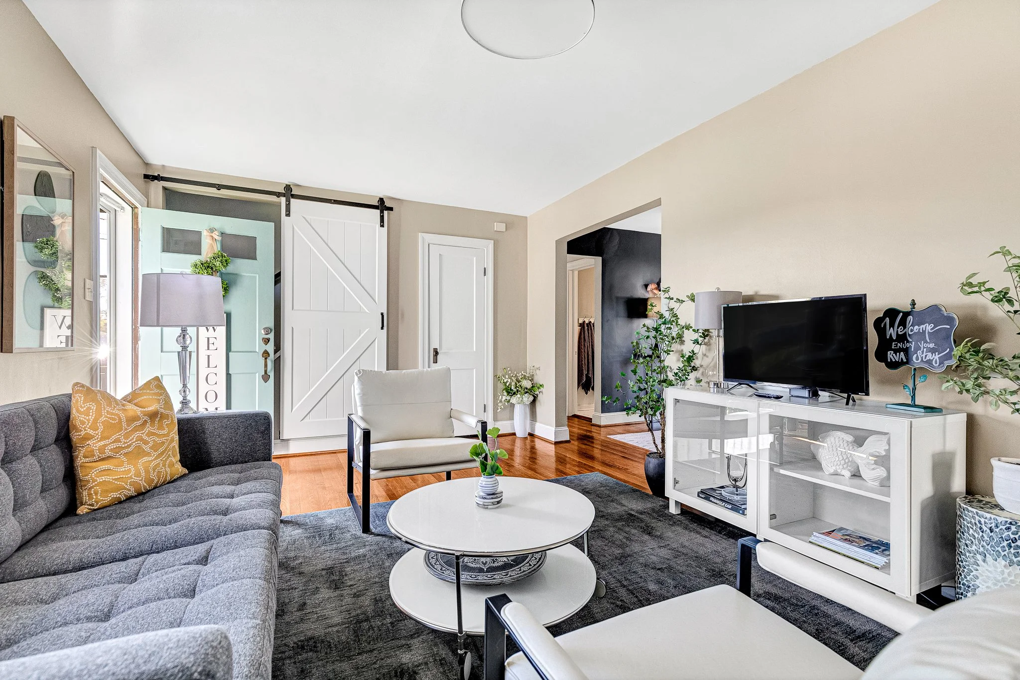 The cozy living room flows into the dining room and features a Smart TV, perfect for relaxed evenings and lazy mornings.