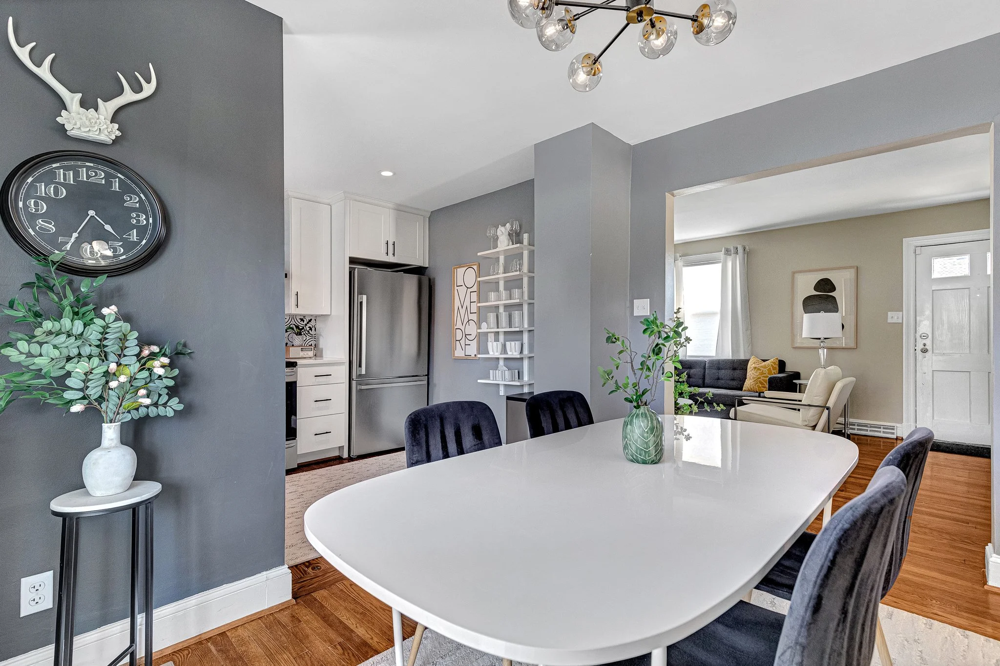 Kitchen, dining room, living room, and deck all connect in a fully open floor plan.