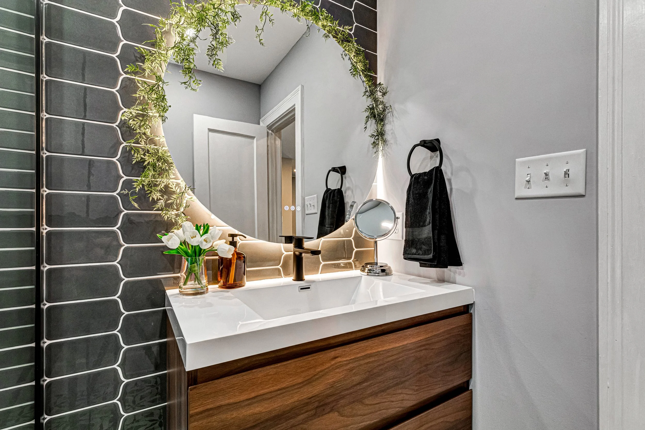 Thoughtfully designed vanity with a large mirror and plenty of space to get ready.