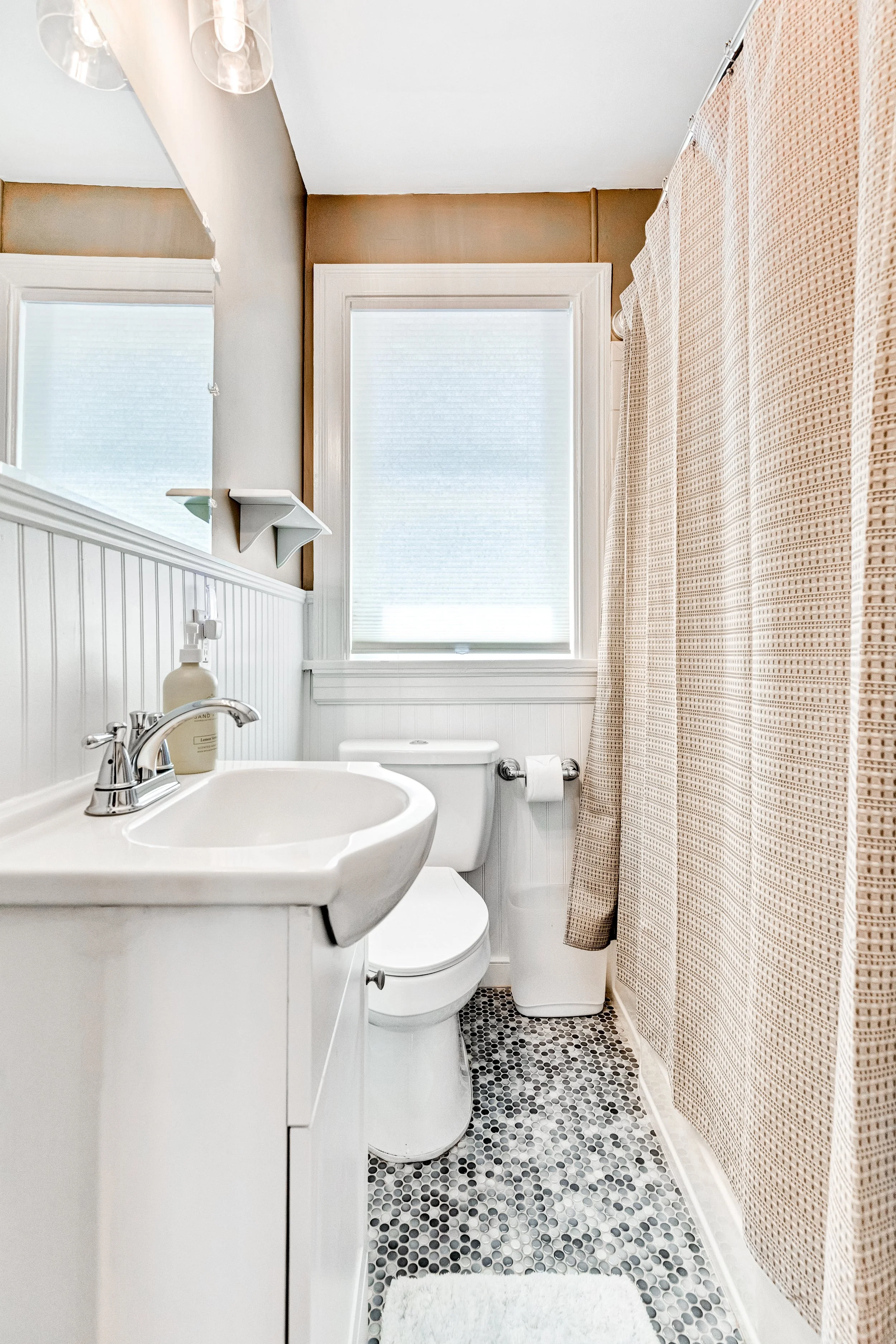 Step into our bright and modern bathroom perfect for your daily routine.