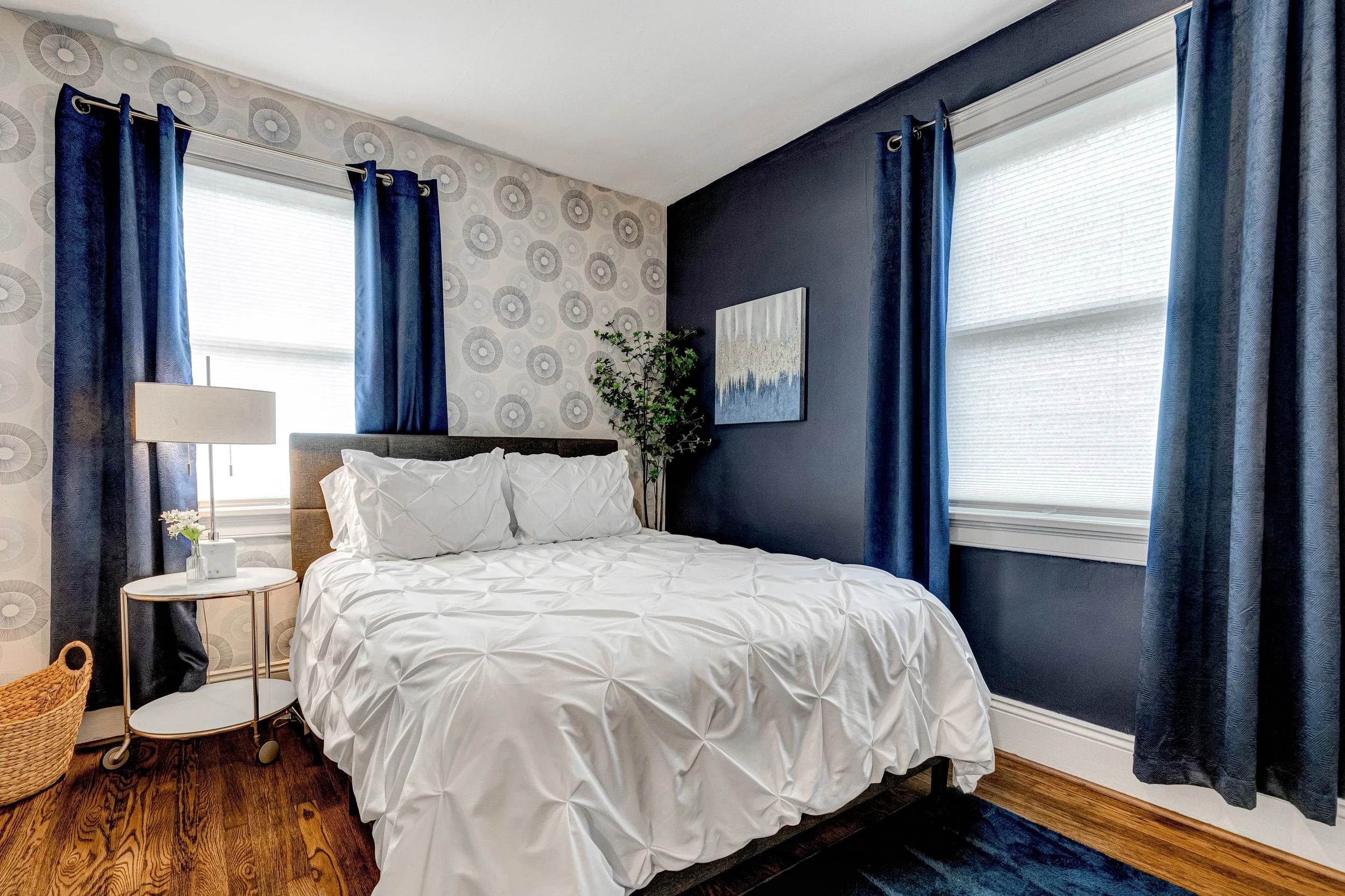 Serene blue bedroom with luxurious bedding for a peaceful nights rest.