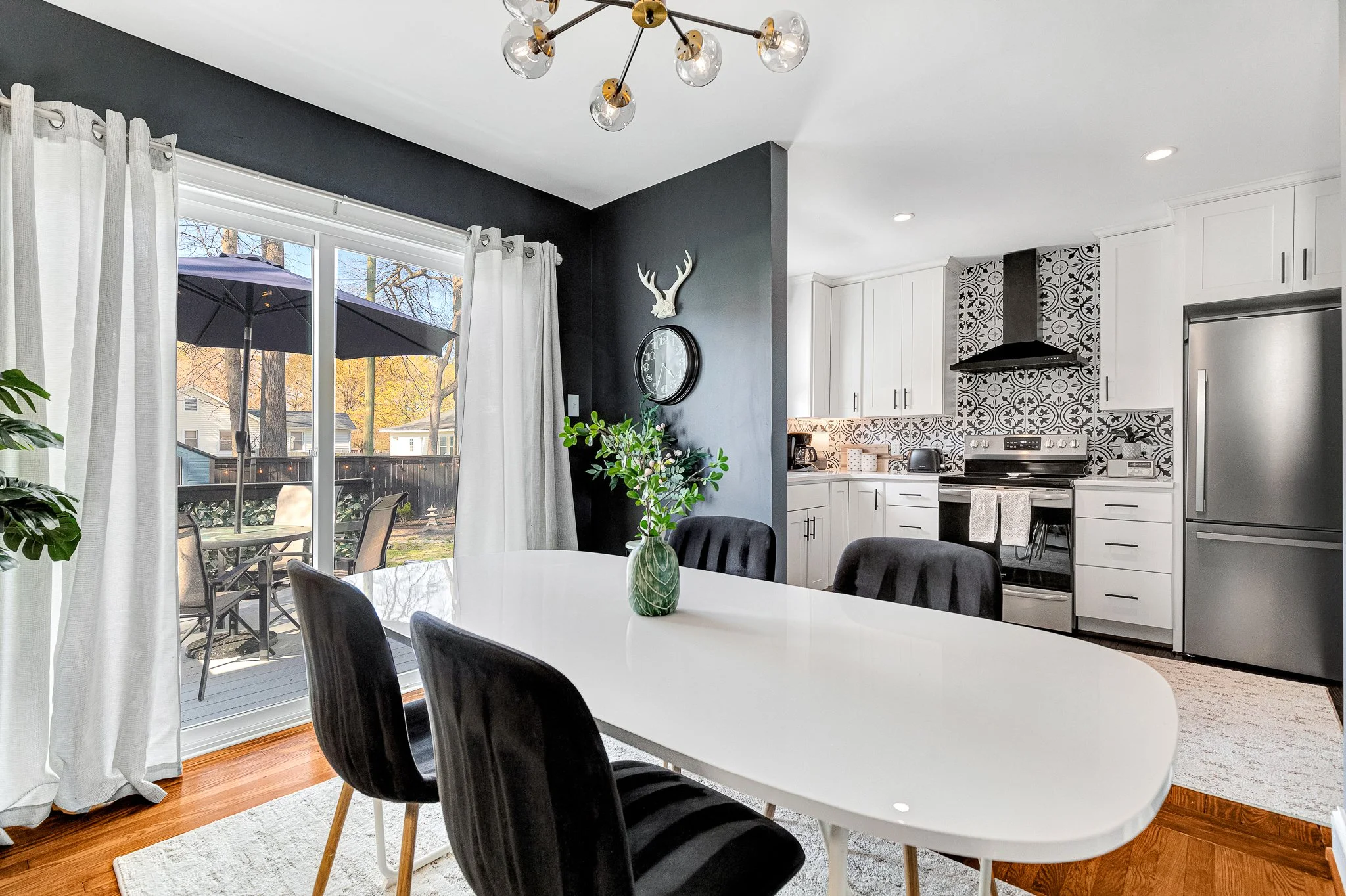 Sun-filled dining room with direct deck access, great for leisurely meals and for enjoying the evening outside.