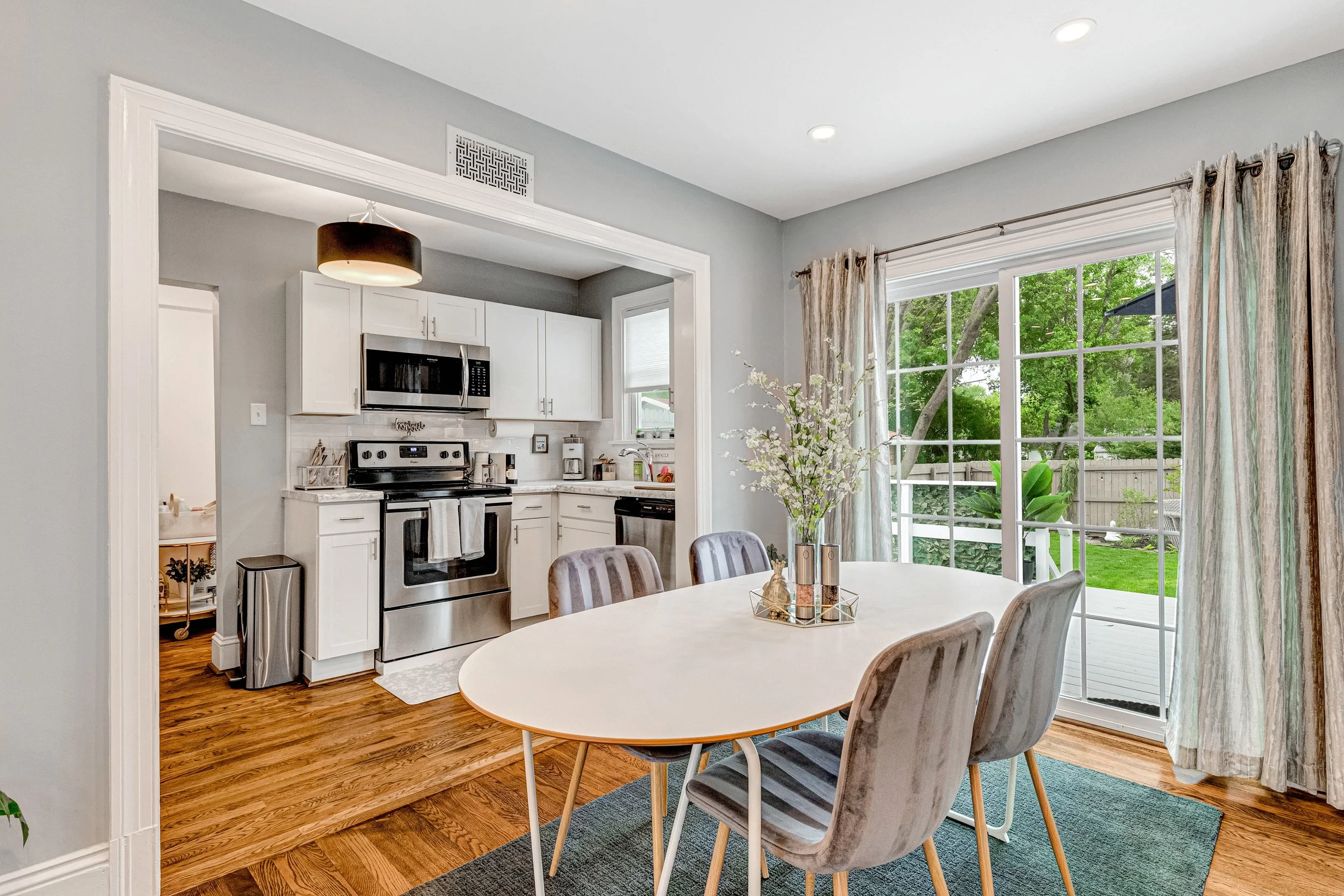 The kitchen, dining room and back deck connect seamlessly for entertaining.