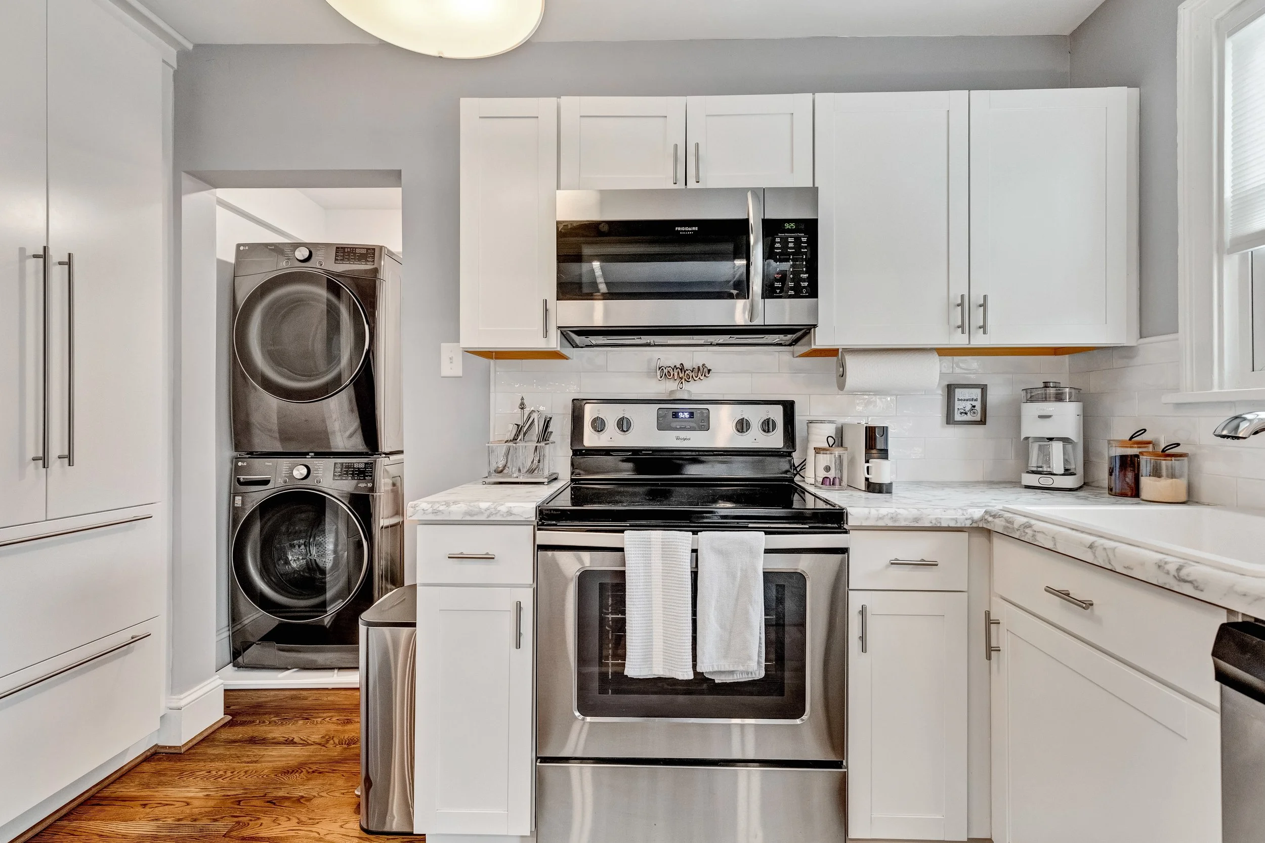Convenience at its best with a full-sized LG washer and dryer in the kitchen.