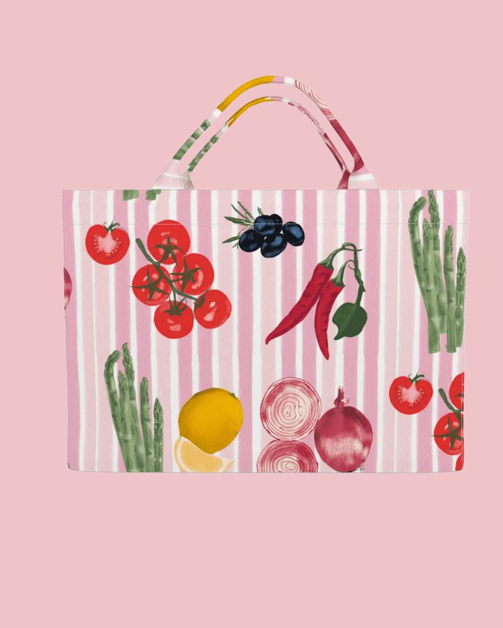 A pink everyday bag with a vegetable and fruit pattern, including tomatoes, olives, red chili peppers, asparagus, lemon, red onion, and onion rings on a pink background with 'Kelly Rideout' written at the bottom.