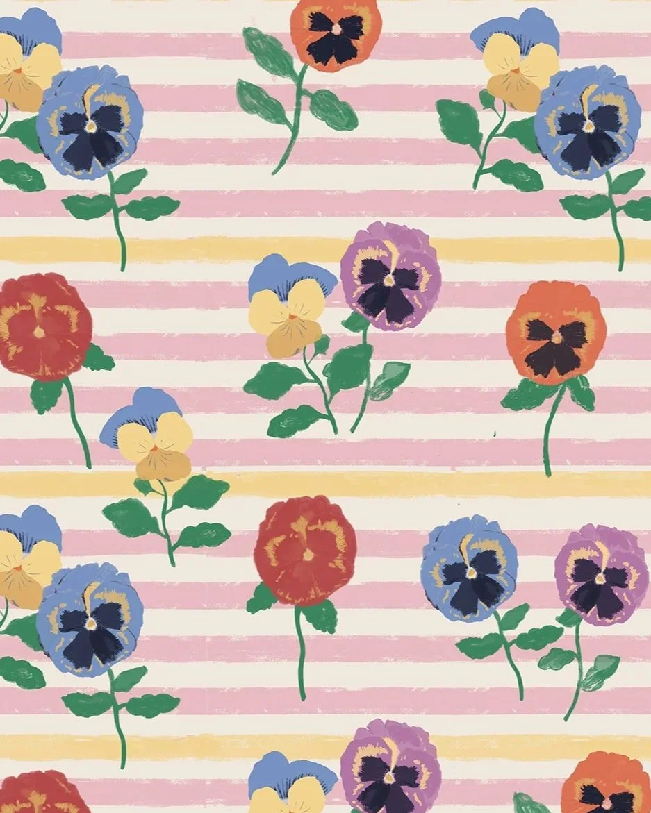 Pattern of colorful pansy flowers on a pink and yellow striped background, with Kelly Rideout's logo at the bottom right corner.