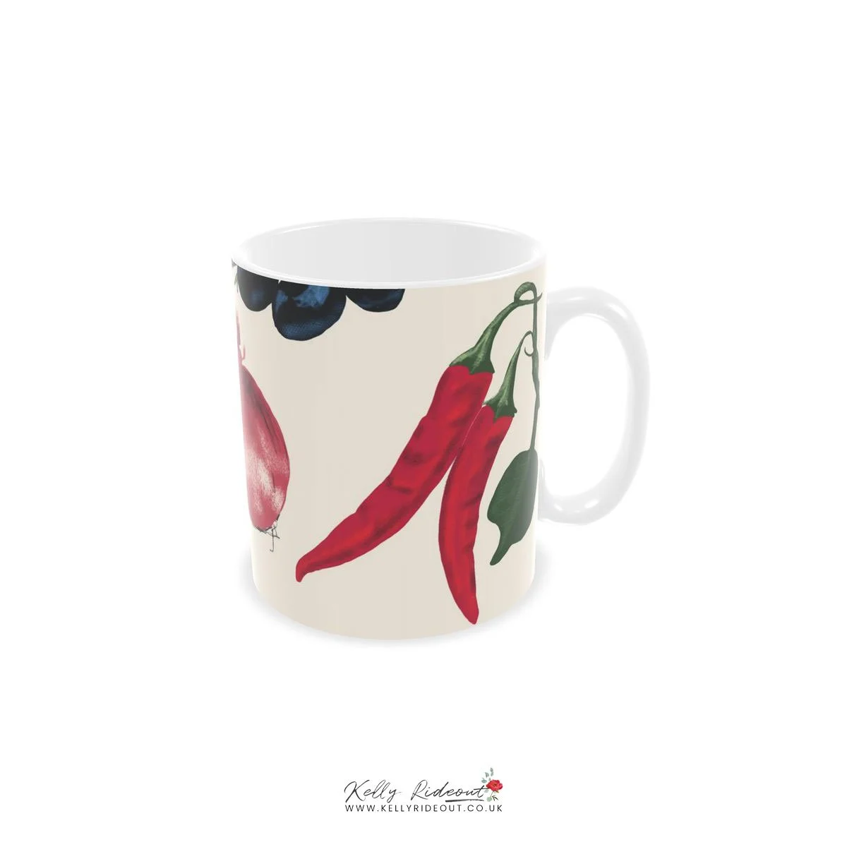 A white mug decorated with a colorful illustration of red chili peppers, a slice of meat, and blueberries.