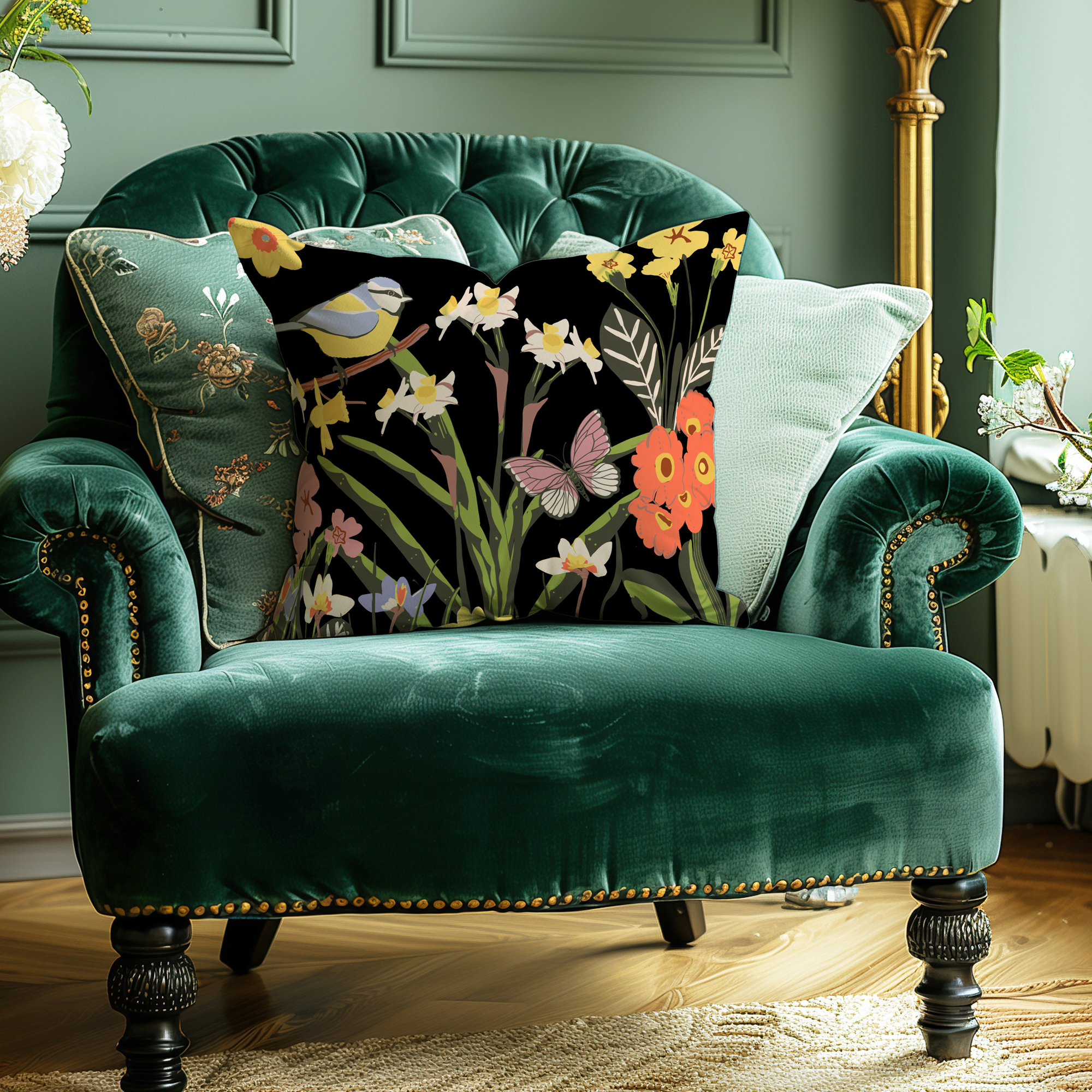 Hand drawn spring florals on black background cushion on green arm chair by Kelly Rideout
