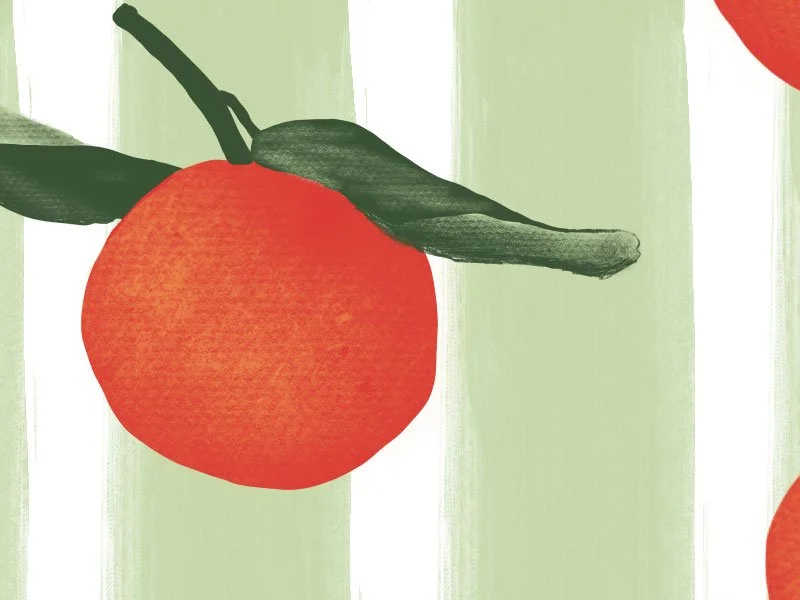 Orange illustrated on striped green tea towel