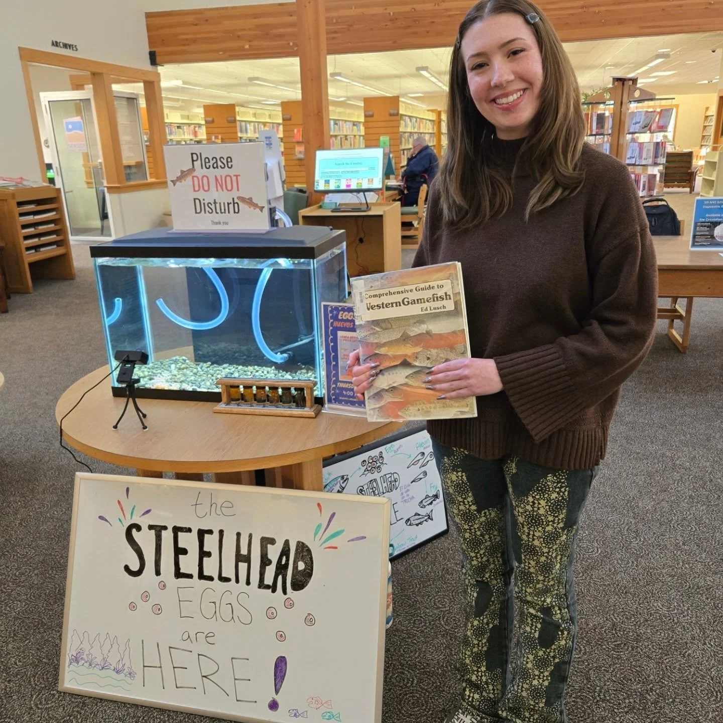 Experience the journey of steelhead eggs in real time! Stop by the Seaside Library today at 4 pm to check on our Eggs to Fry tank or watch the YouTube live (link in bio) and witness these incredible fish develop right before your eyes. Visit our webp