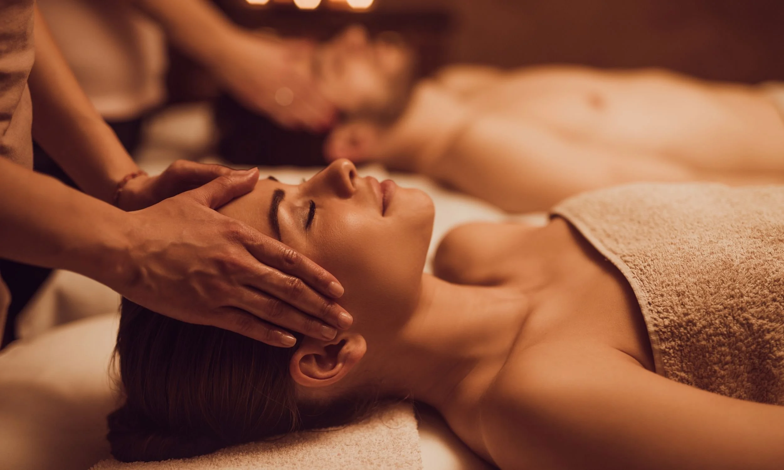 Guest relaxing during a facial massage