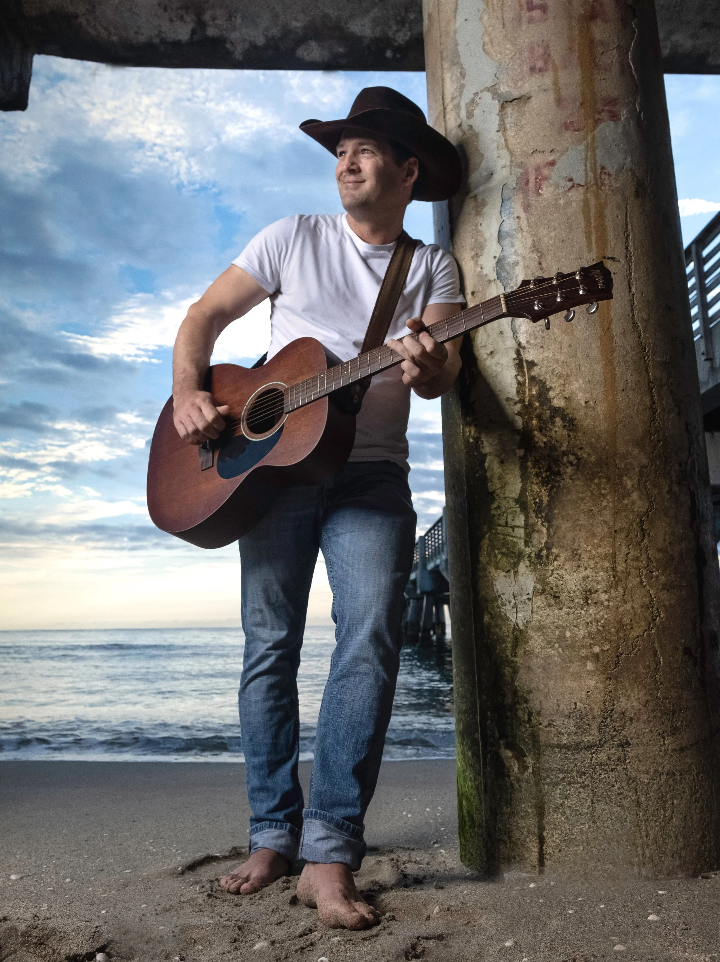 Environmental portrait of a working musician photographed outdoors at sunset for editorial storytelling, album promotion, branding, and press use.