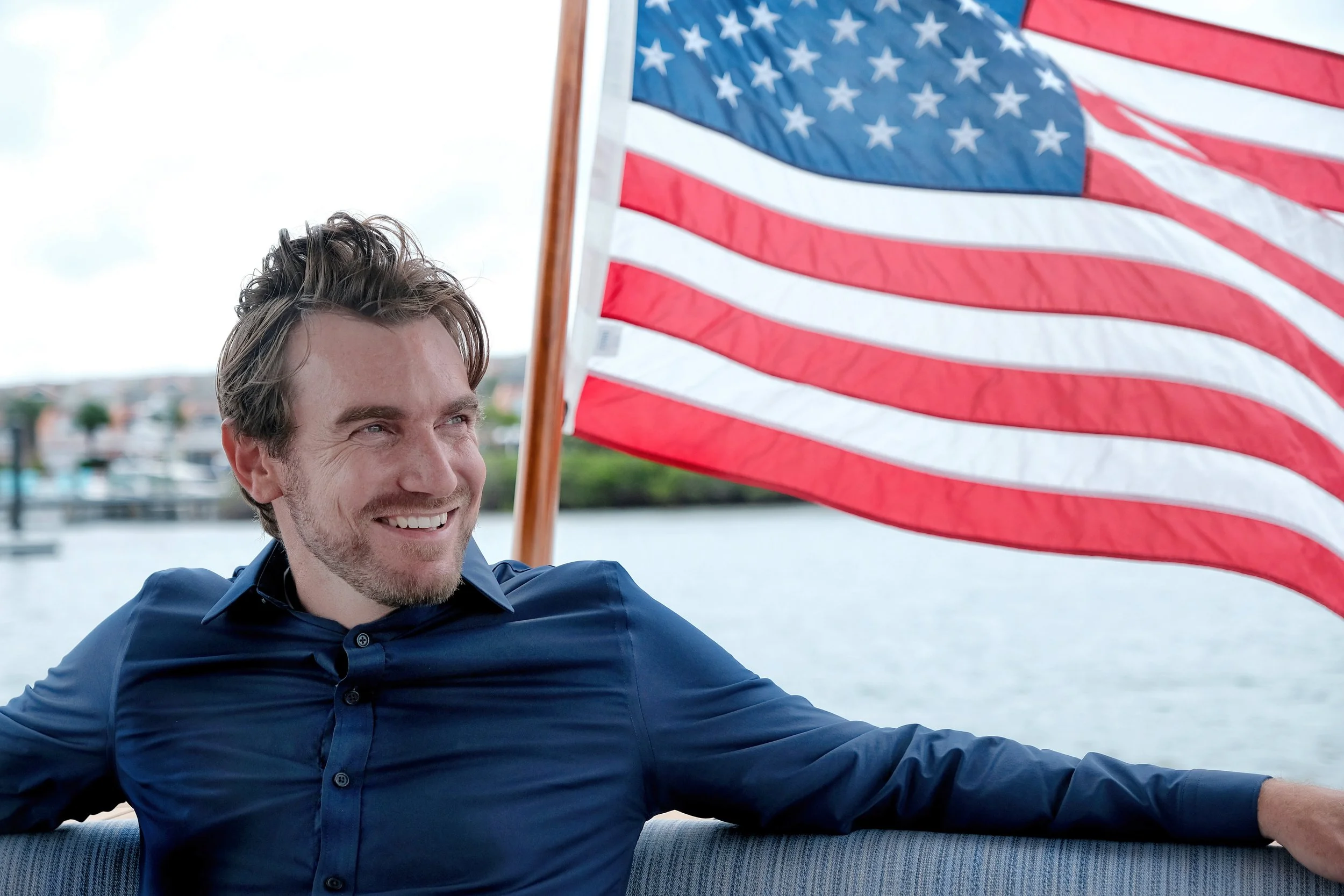 MAN WITH AMERICAN FLAG – PATRIOTIC EDITORIAL

Editorial portrait of a male subject photographed with the American flag in natural light for patriotic branding, magazine features, documentary storytelling, and promotional use.