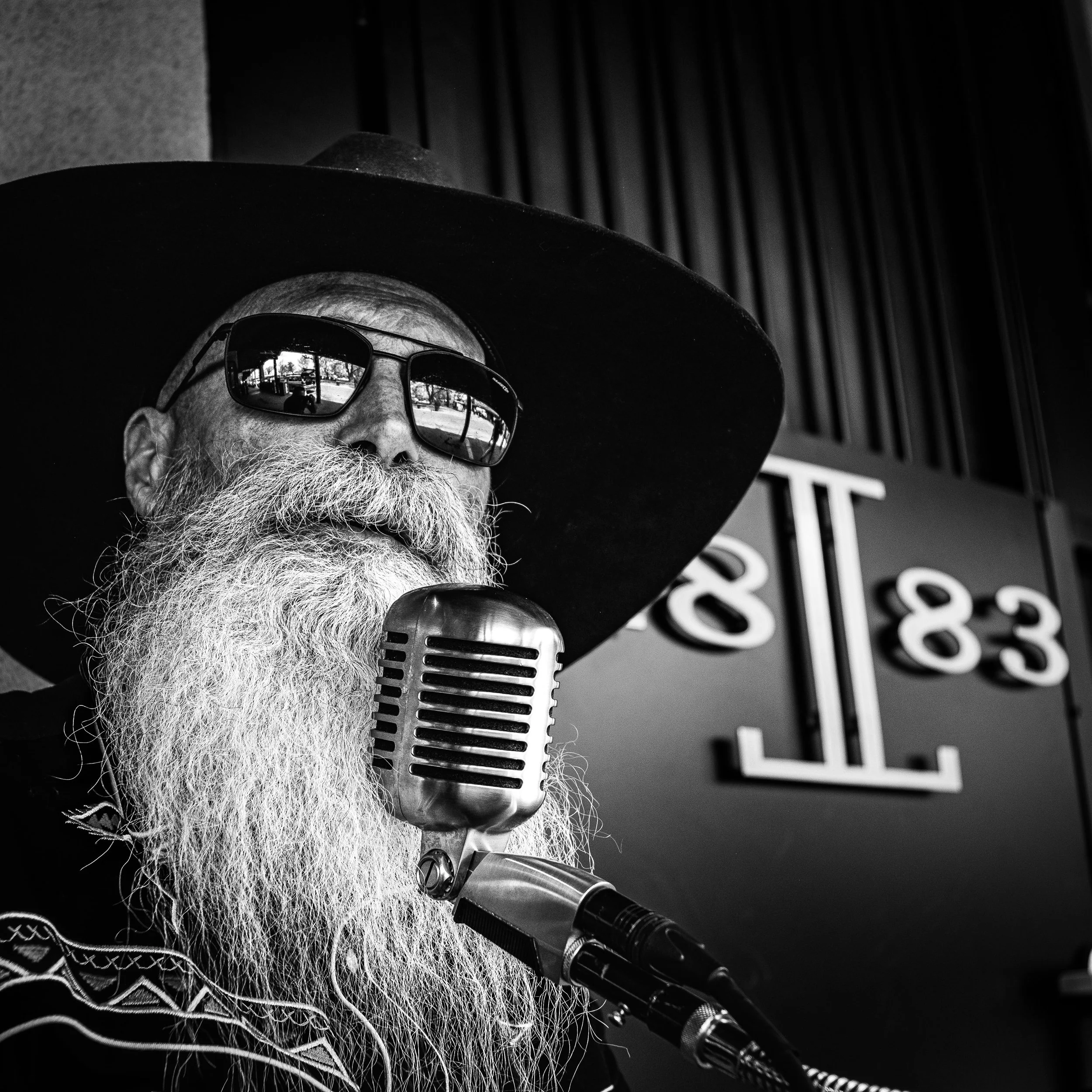 Environmental portrait of a working musician photographed outdoors at sunset for editorial storytelling, album promotion, branding, and press use.