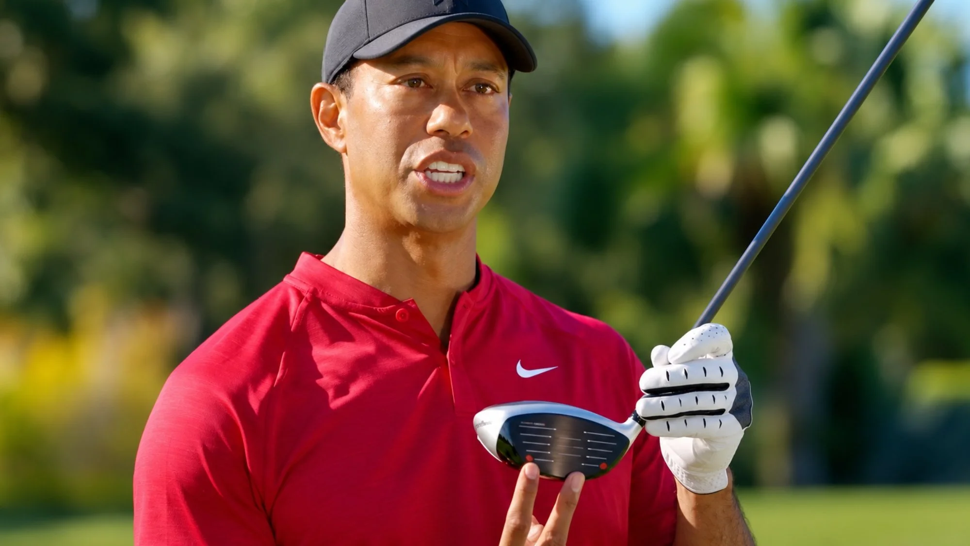 Tiger Woods holding a golf club in a commercial featuring cinematography by Paul Piasecki.