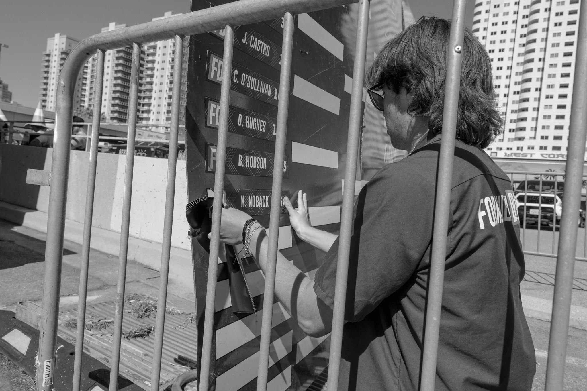 A woman in sunglasses and a jacket with 