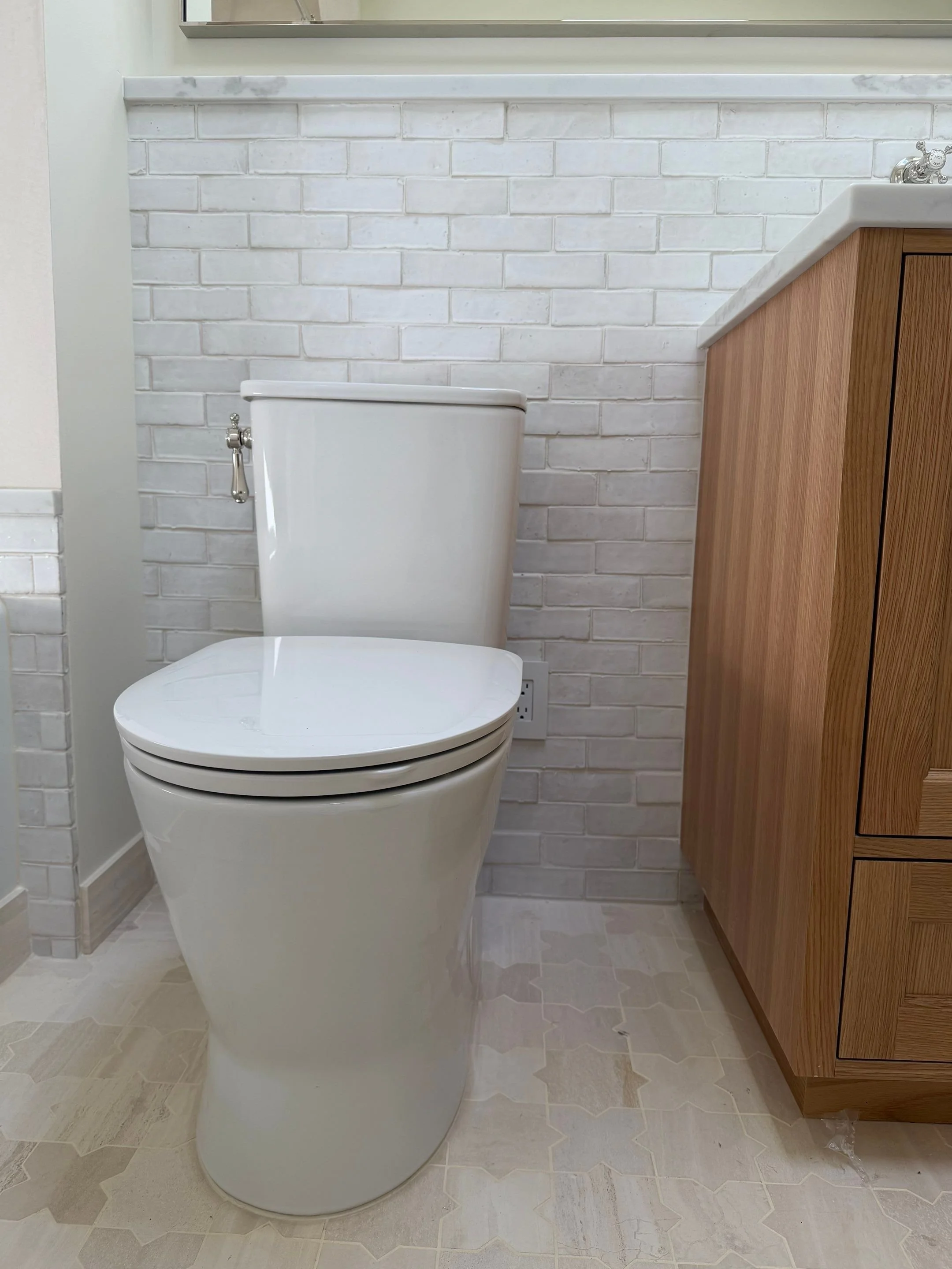 Bathroom with white subway tile and built-in wood cabinetry — Discovery Park, Seattle whole-home addition