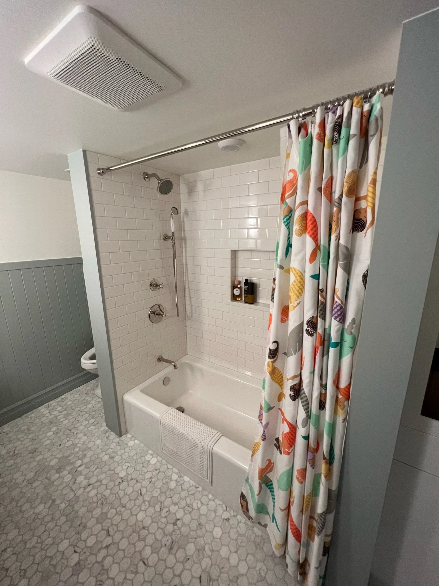 Original tub and shower with dated tile prior to renovation — Magnolia, Seattle full home remodel