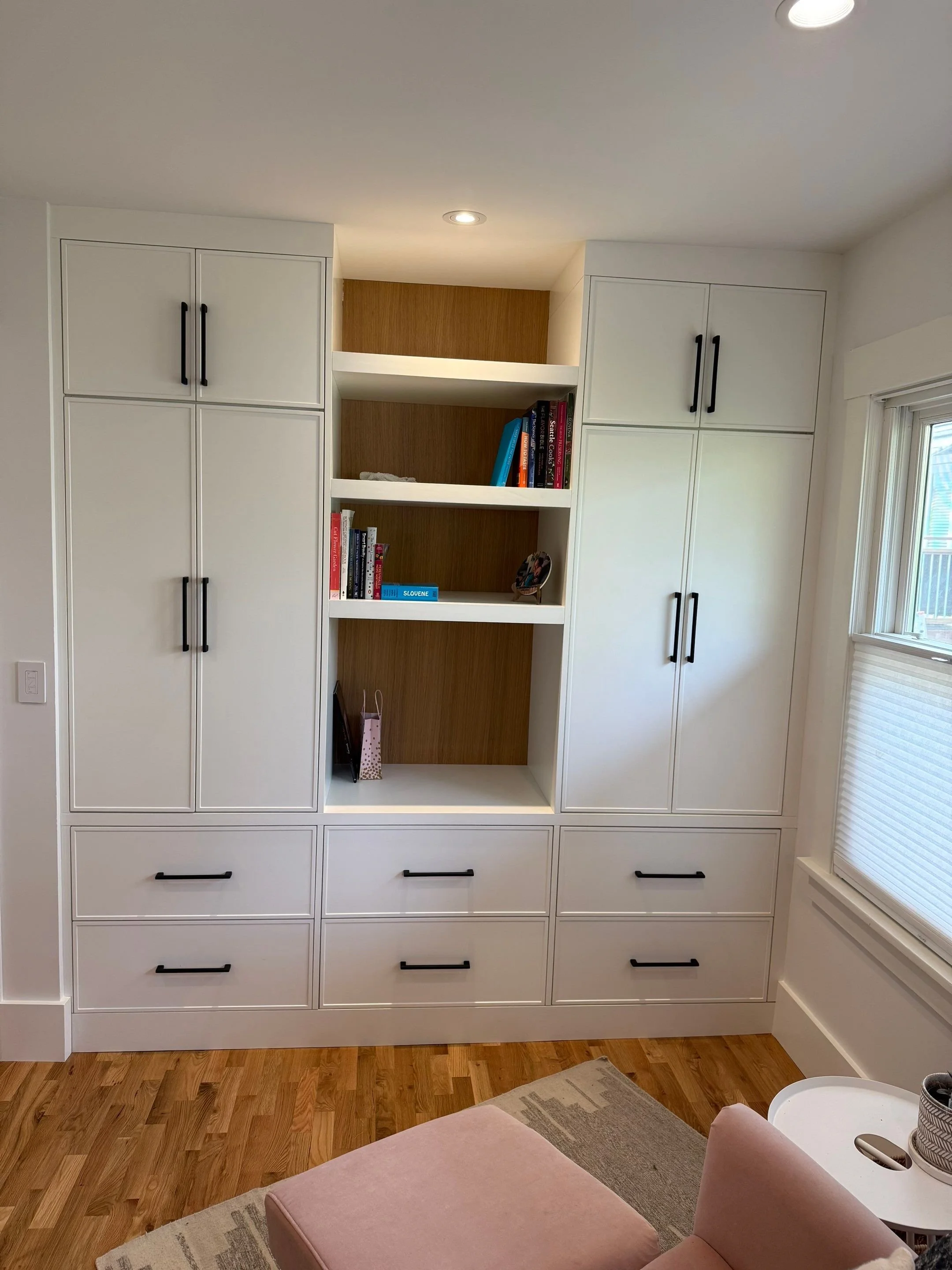 Built-in white cabinetry with open bookshelves for storage — Wallingford, Seattle kitchen and bath remodel