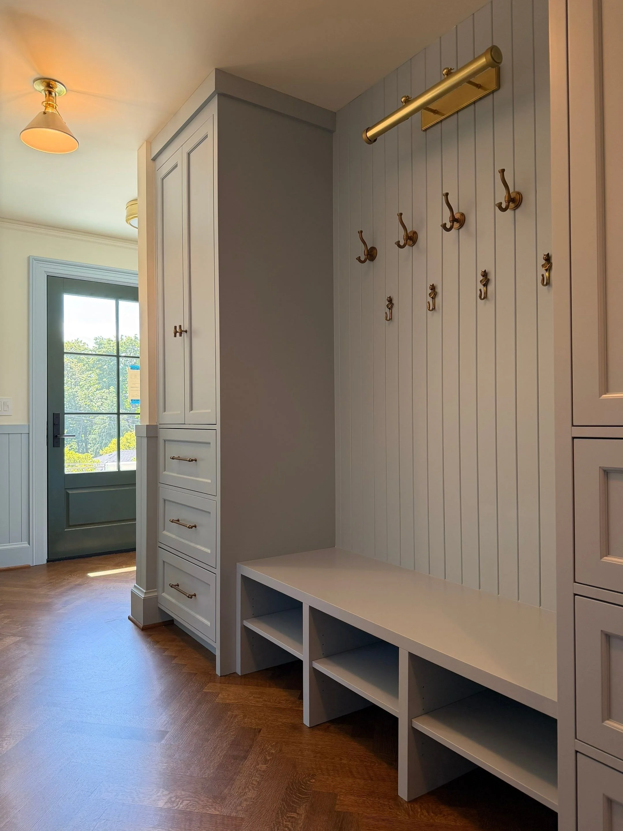 Built-in mudroom with bench, cubbies, and coat hooks — Discovery Park, Seattle whole-home addition