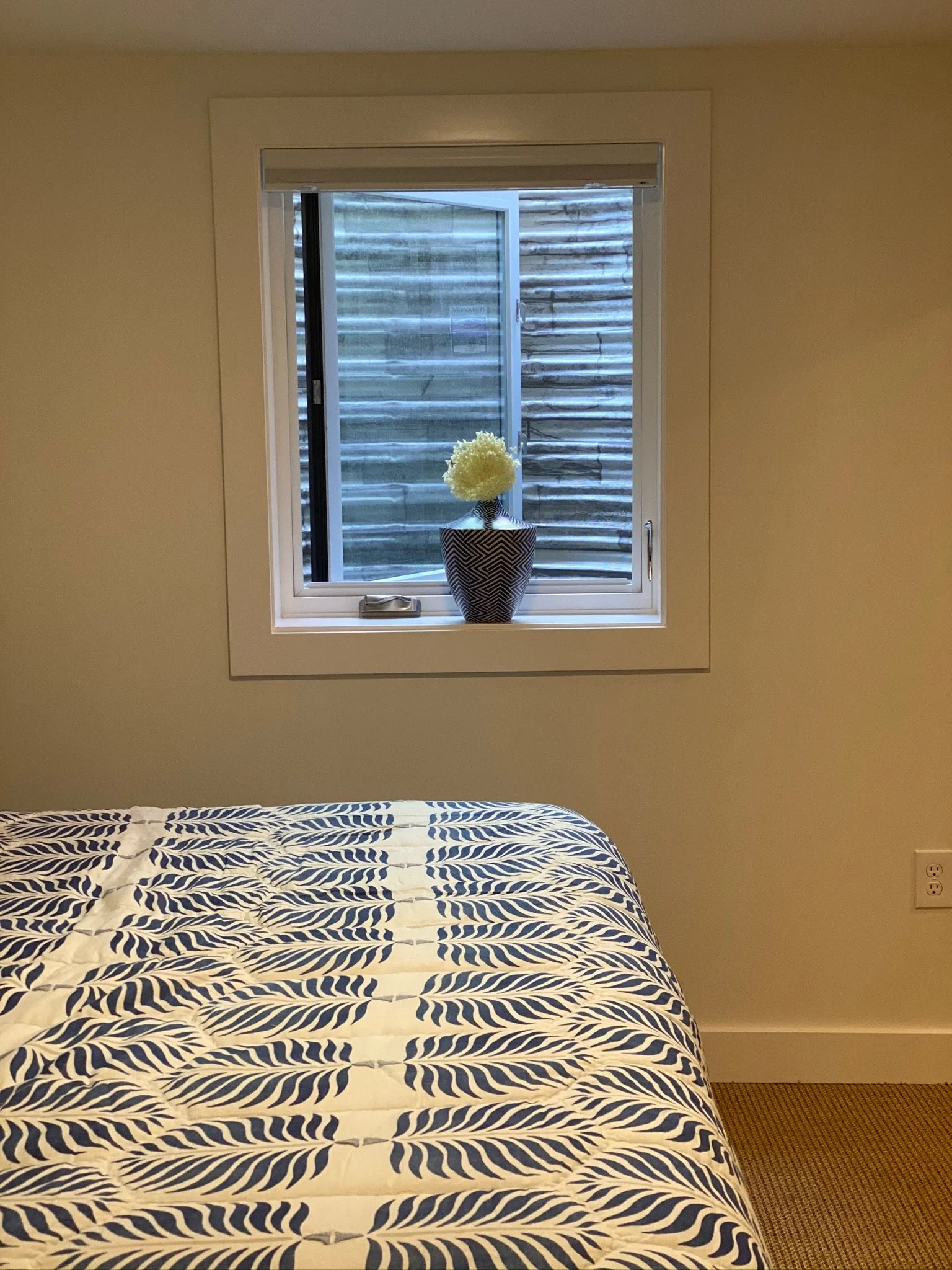 Bedroom with window seat and patterned bedding — Magnolia, Seattle full home remodel