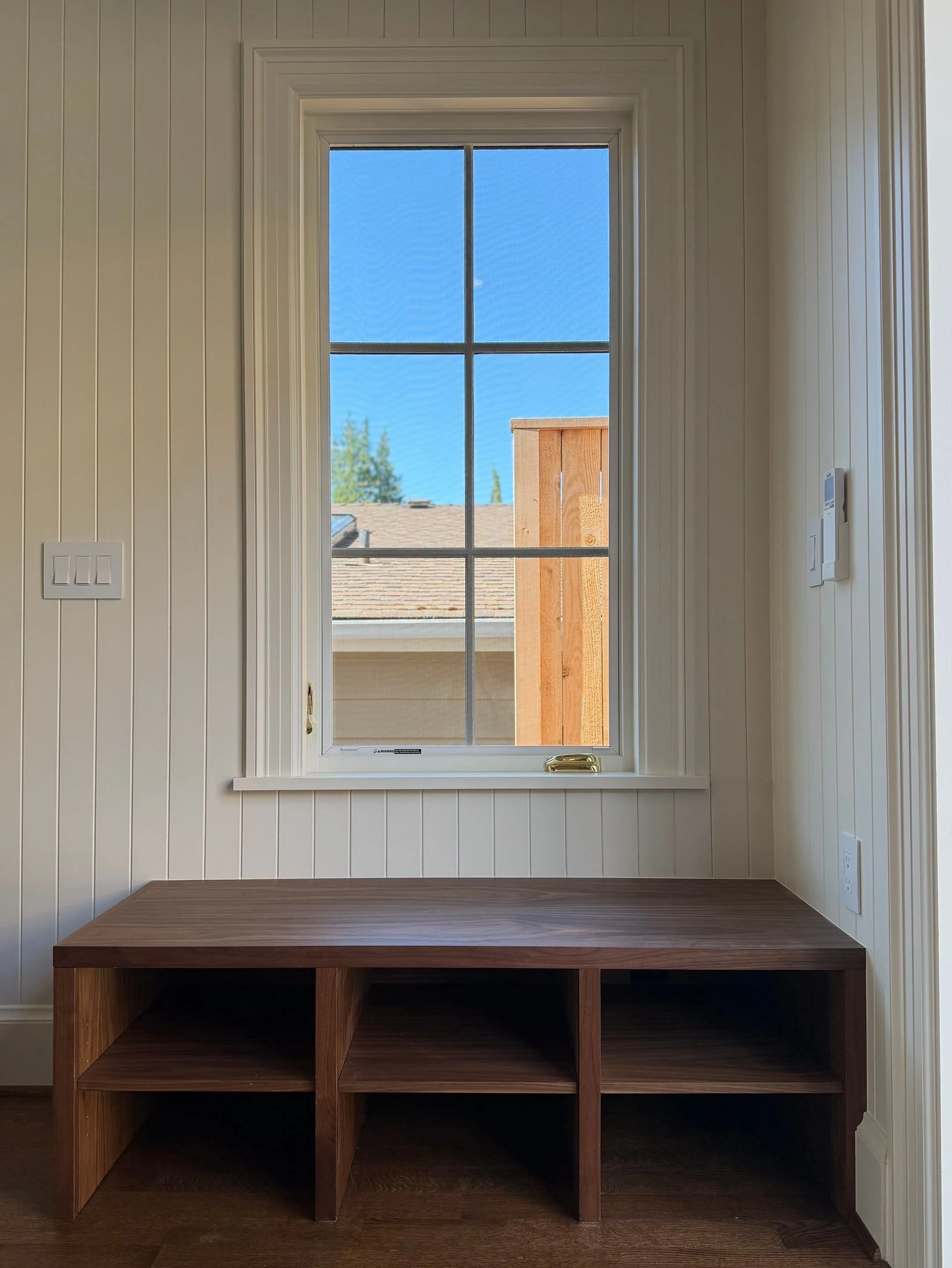 Built-in mudroom cubbies beneath a window — Discovery Park, Seattle whole-home addition