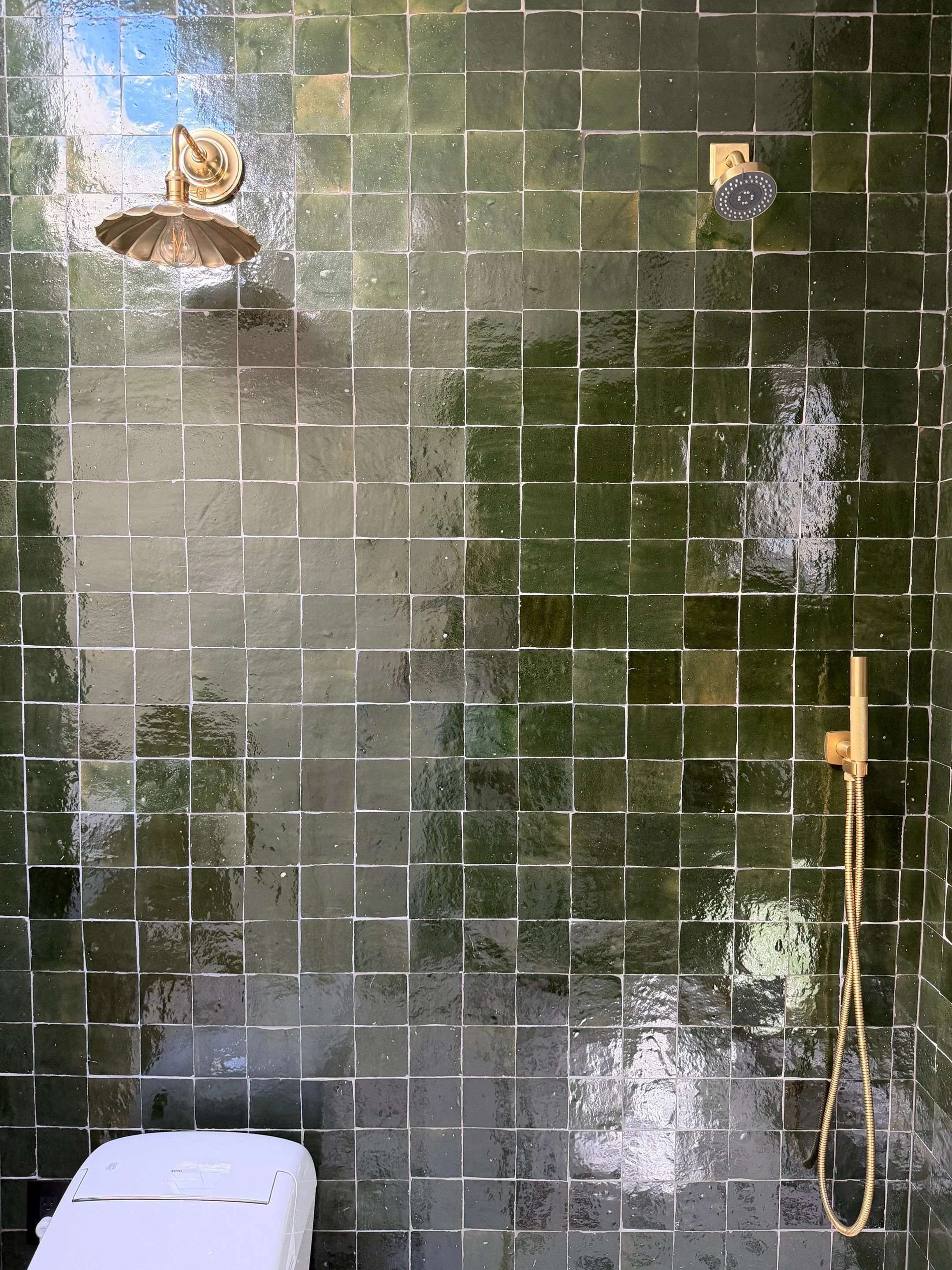 Rain shower with dark green hexagonal tile surround — Discovery Park, Seattle whole-home addition