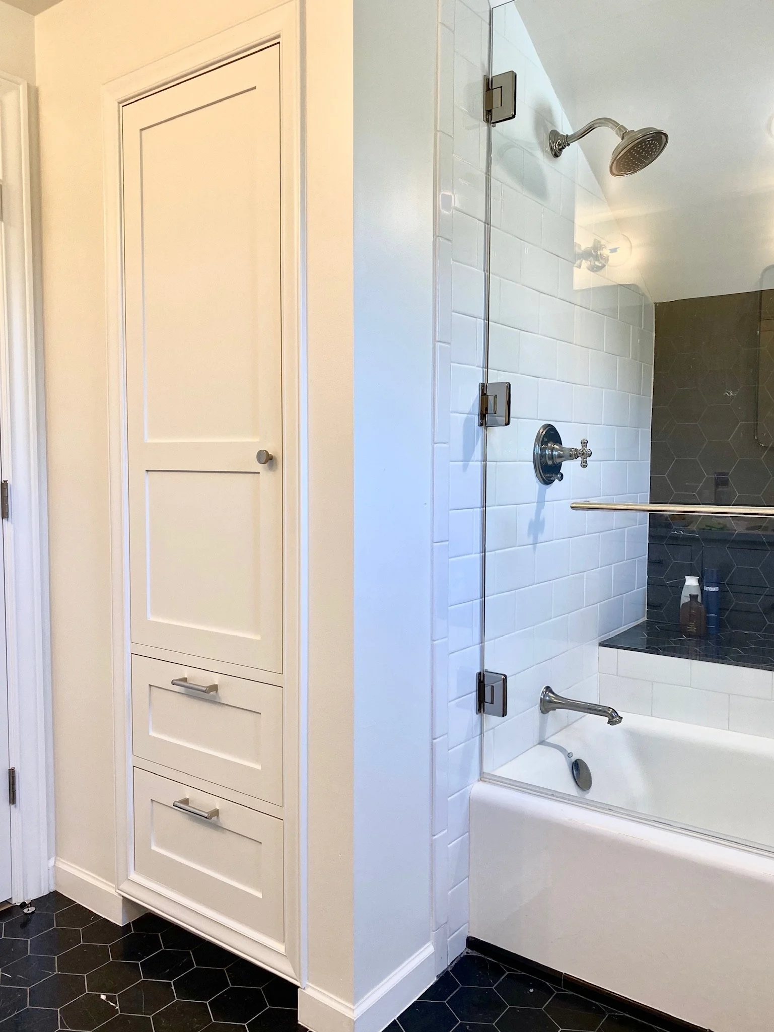 Built-in linen closet next to the tub and shower — Magnolia, Seattle full home remodel