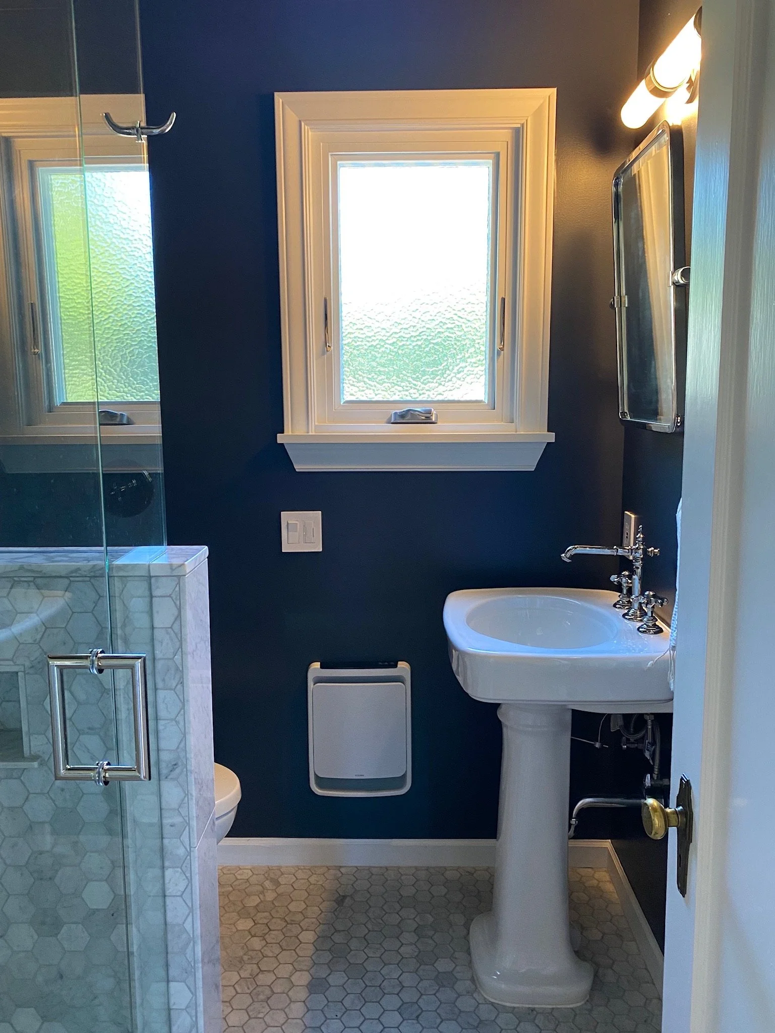 Powder room with navy blue wainscoting and pedestal sink — Magnolia, Seattle full home remodel