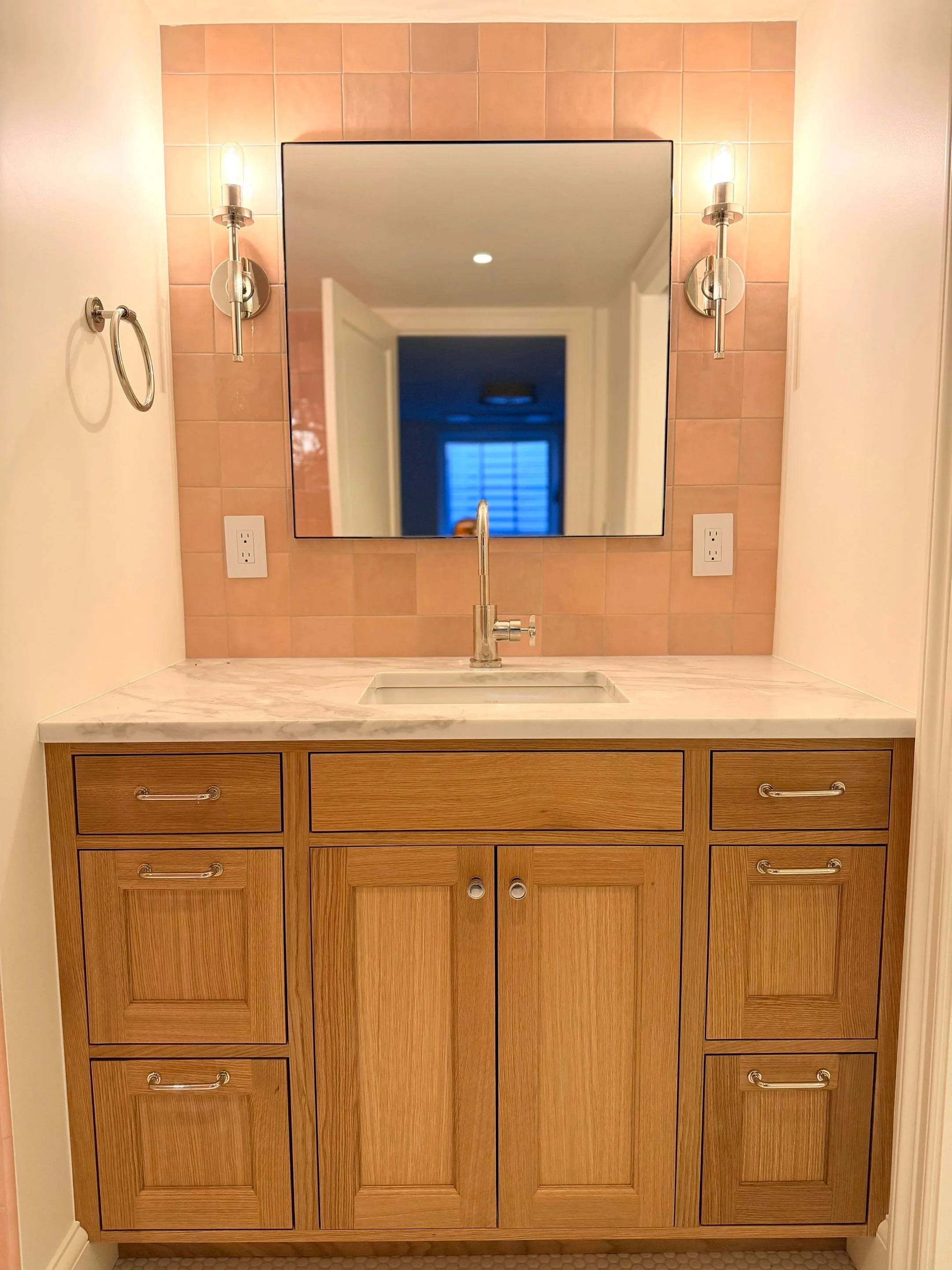 Bathroom vanity with peach walls and oak cabinetry prior to renovation — Discovery Park, Seattle whole-home addition