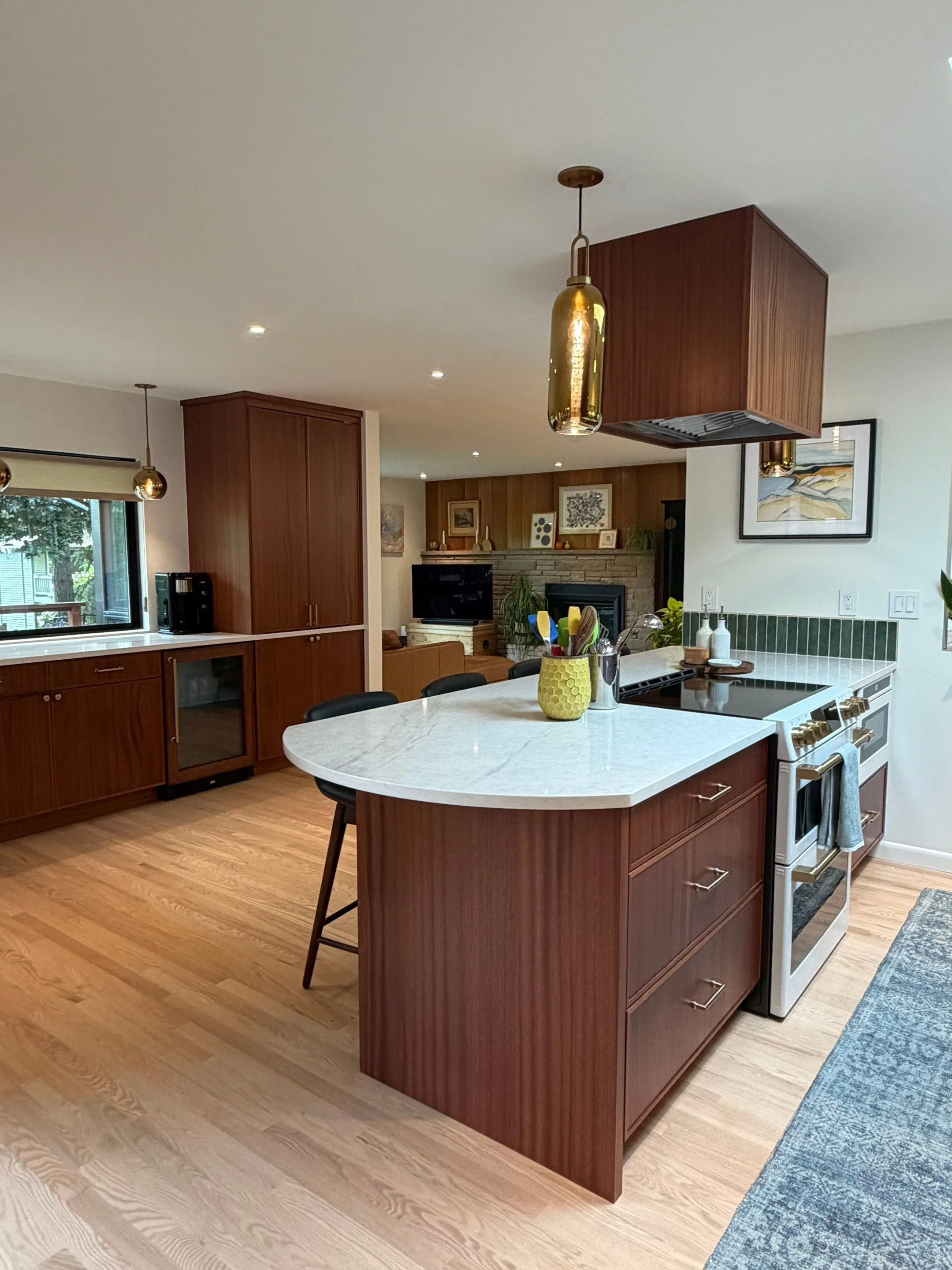 Kitchen with white cabinetry and wood island — Seattle remodel