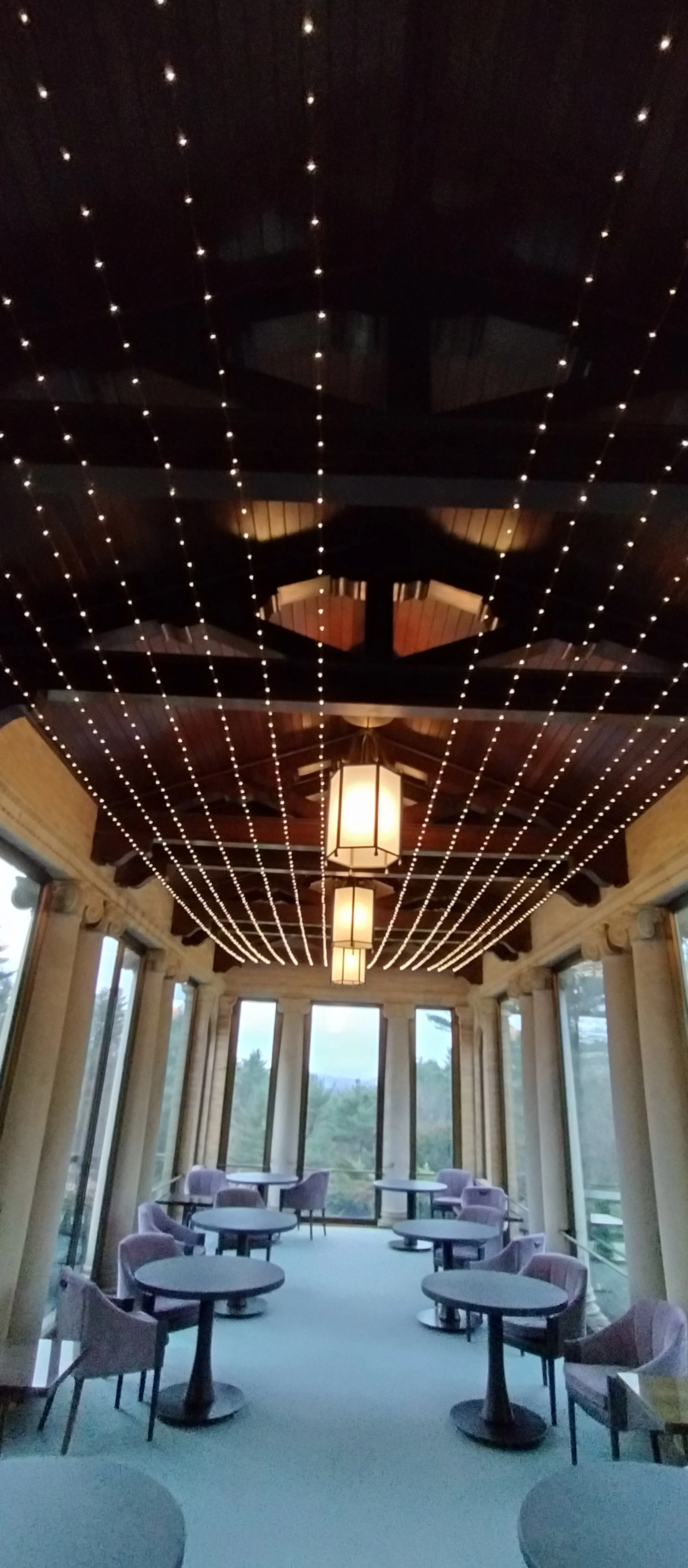 Structural portico string lighting at Wheatleigh in Lenox, MA, by Berkshire Event Lighting.