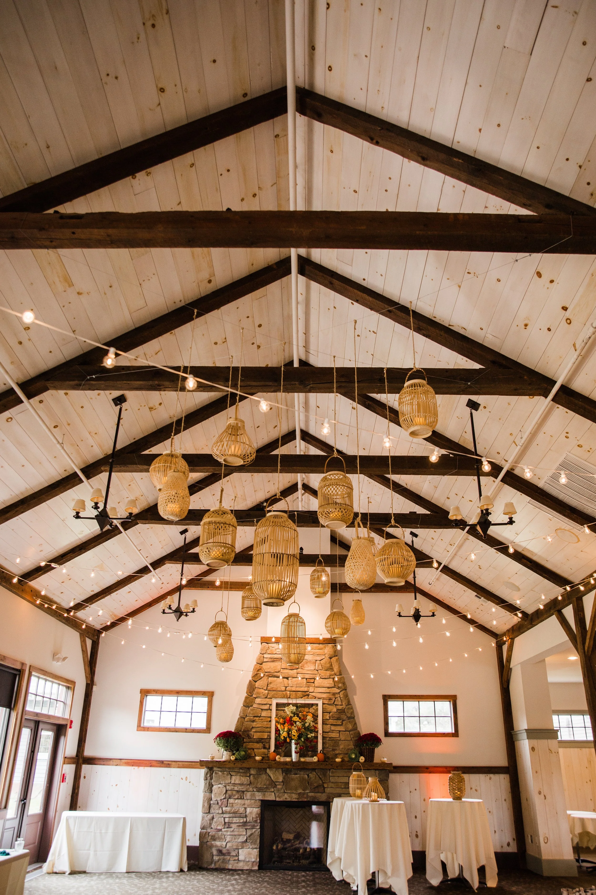 Bistro string lighting and bamboo lantern clusters with pillar candles by Berkshire Event Lighting at Barrington Hall, Great Barrington MA