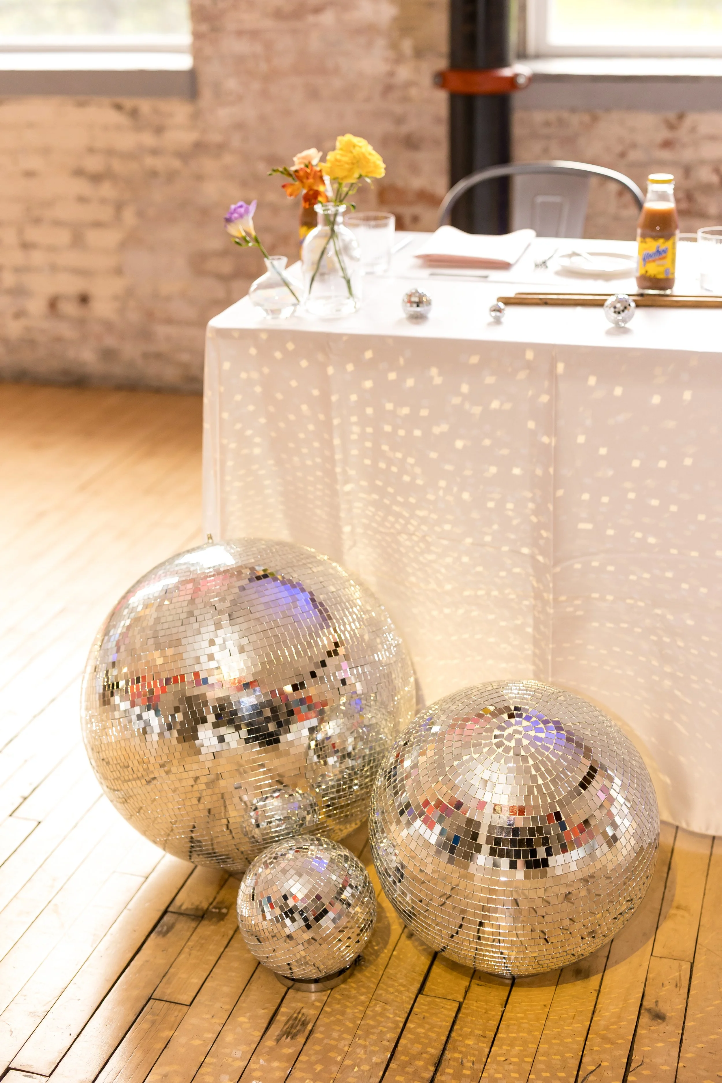 Professional disco ball rentals in multiple sizes for wedding dance floors by Berkshire Event Lighting.