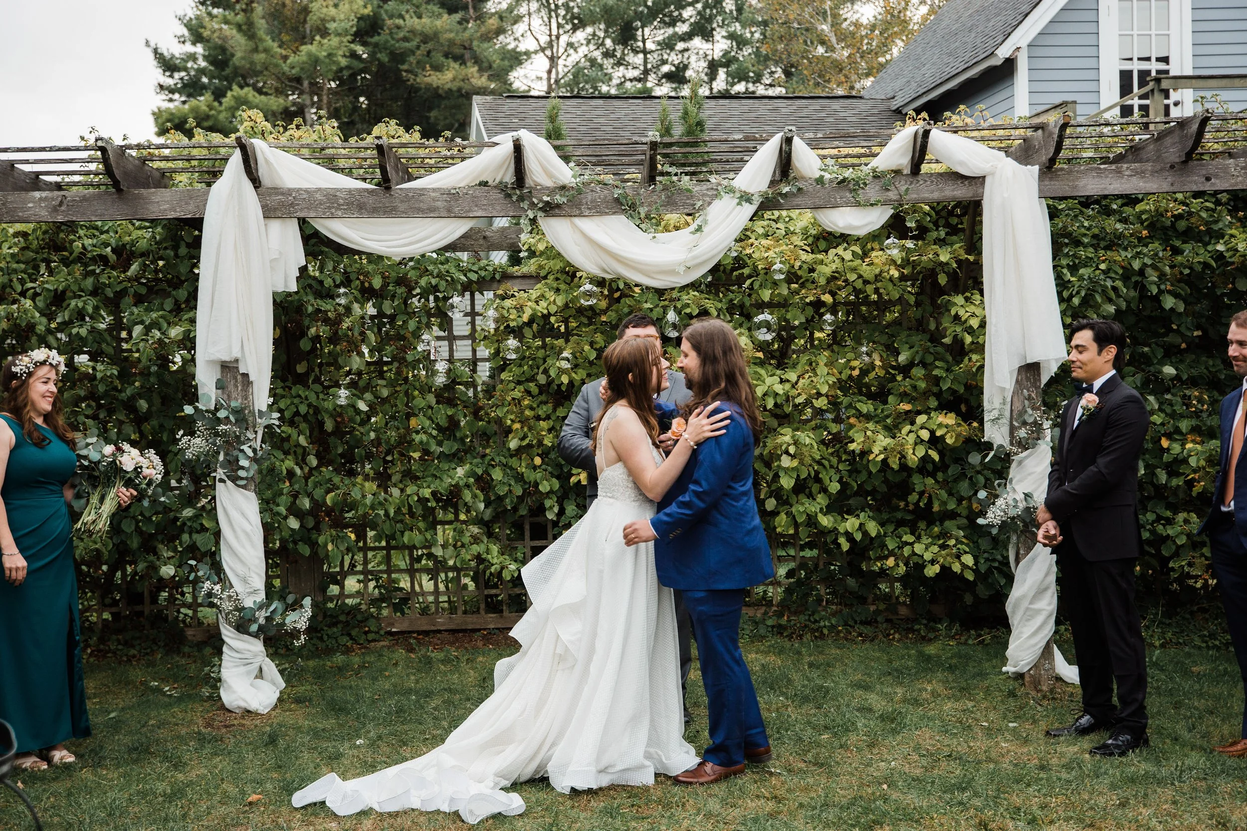 ceremony arbor draping with hanging clear glass globes by Berkshire Event Lighting at Berkshire Hall in Great Barrington, MA.