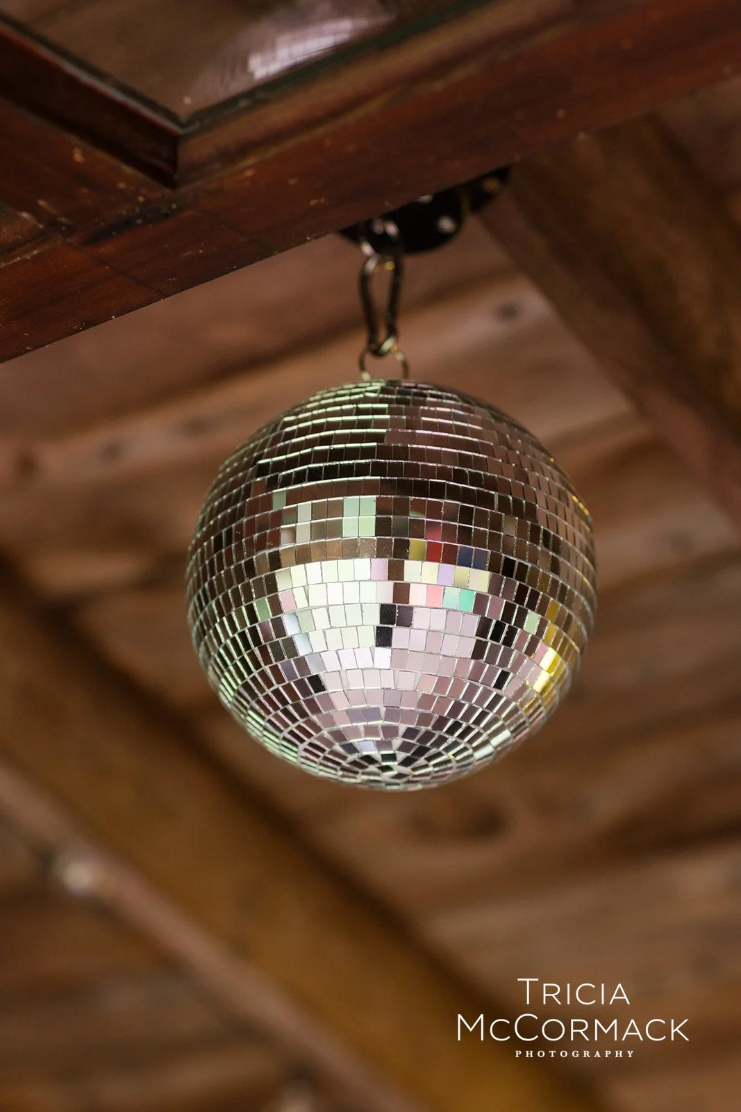 Small disco ball installation in a rustic residential barn, New Marlborough MA, by Berkshire Event Lighting.