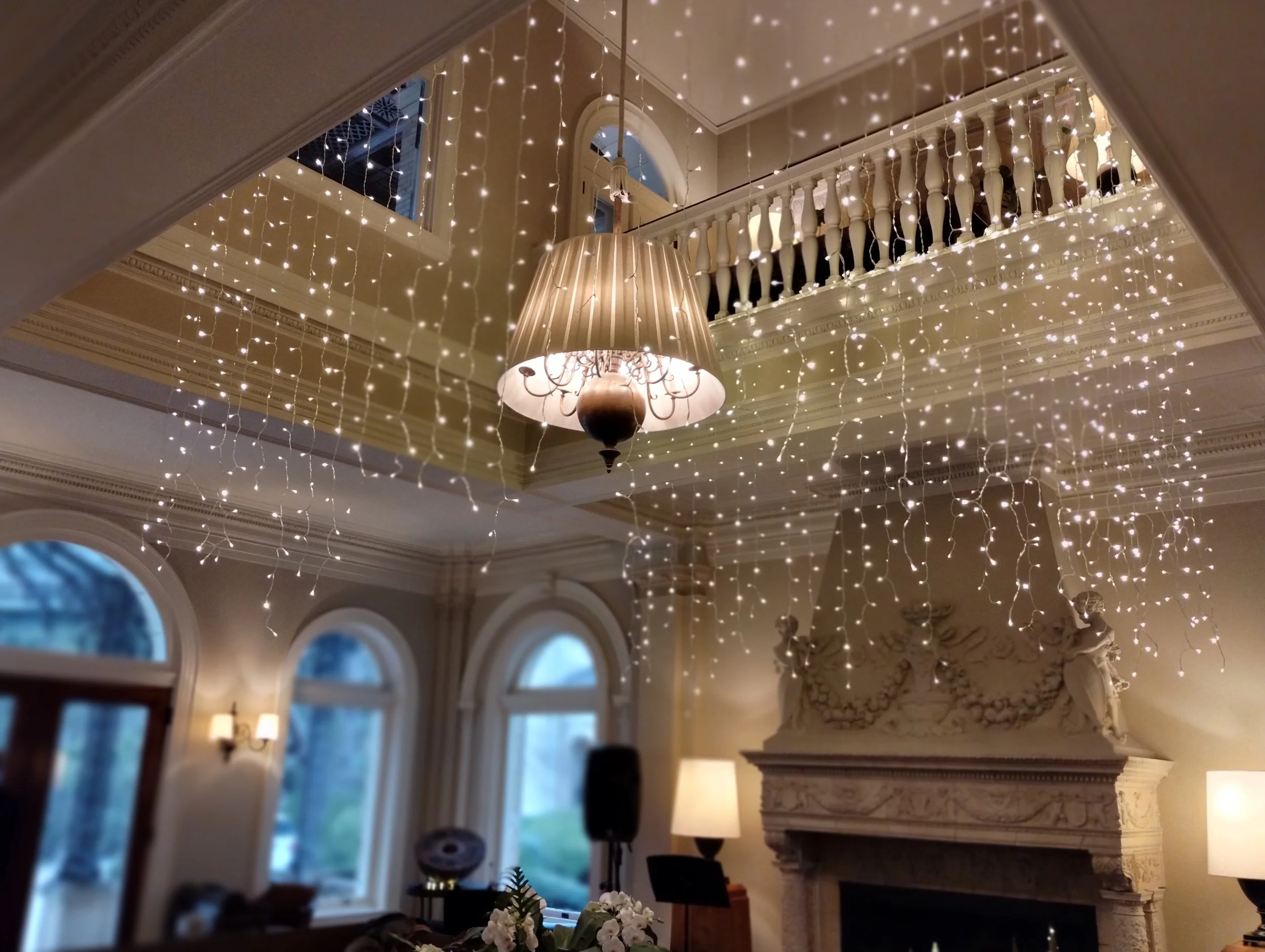 Waterfall light curtain installation by Berkshire Event Lighting on the grand staircase at Wheatleigh, Lenox MA.