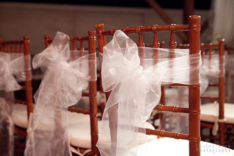 Sheer white fabric used for wedding chair bows and decorative tie back on tent pole draping by Berkshire Event Lighting.