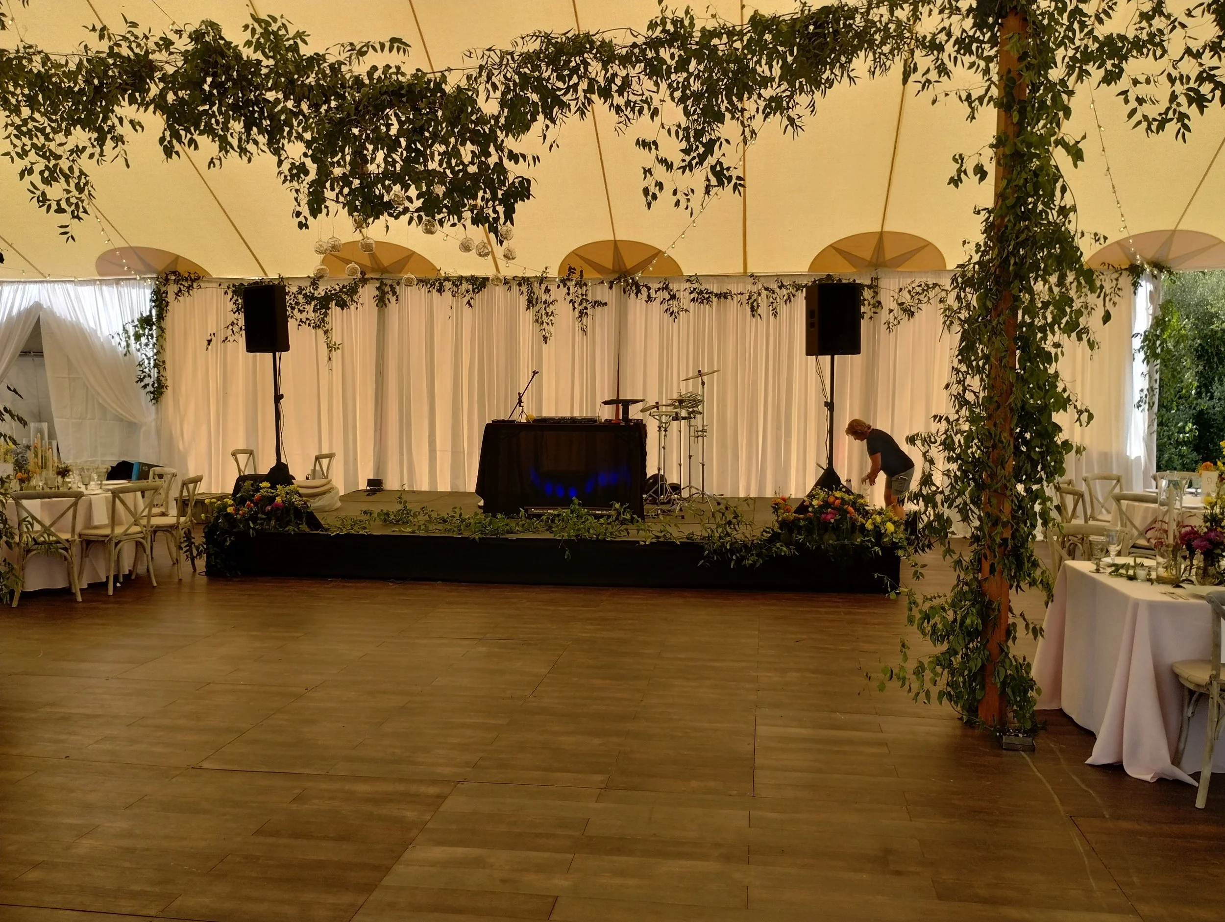 Full pipe & drape fabric curtain backdrop draped behind band in a sailcloth tent by Berkshire Event Lighting