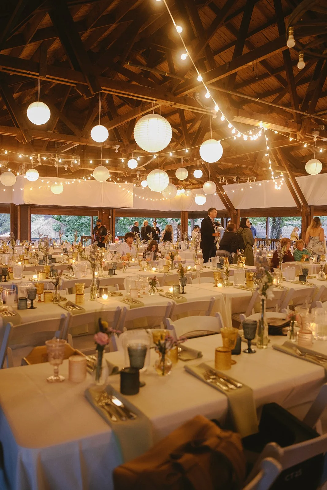Wedding fabric draping and multi-sized paper lantern installation by Berkshire Event Lighting at Camp Taconic, Hinsdale MA.