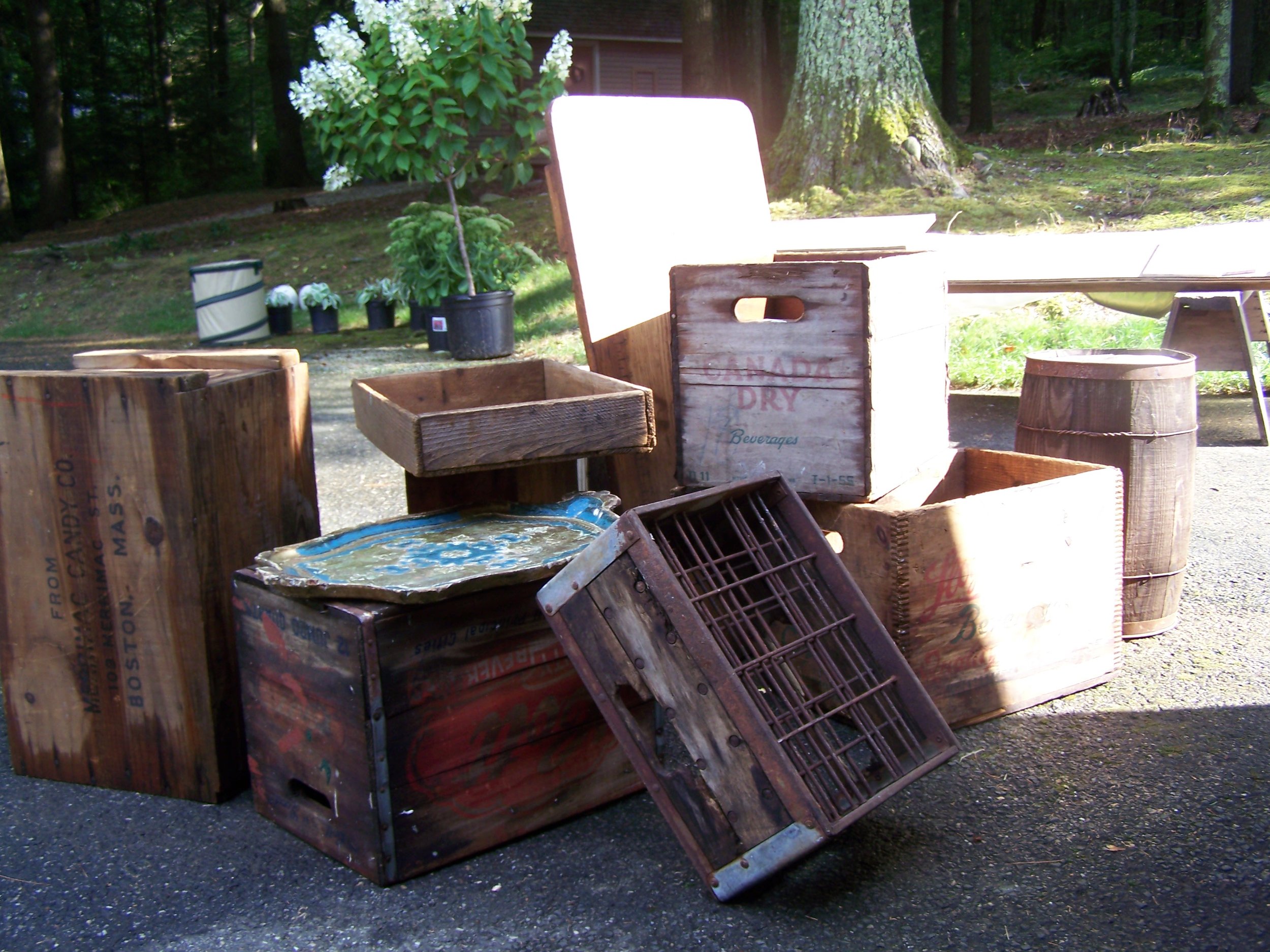 A variety of vintage wooden crates and boxes in multiple sizes and finishes for rustic wedding decor by Berkshire Event Lighting.