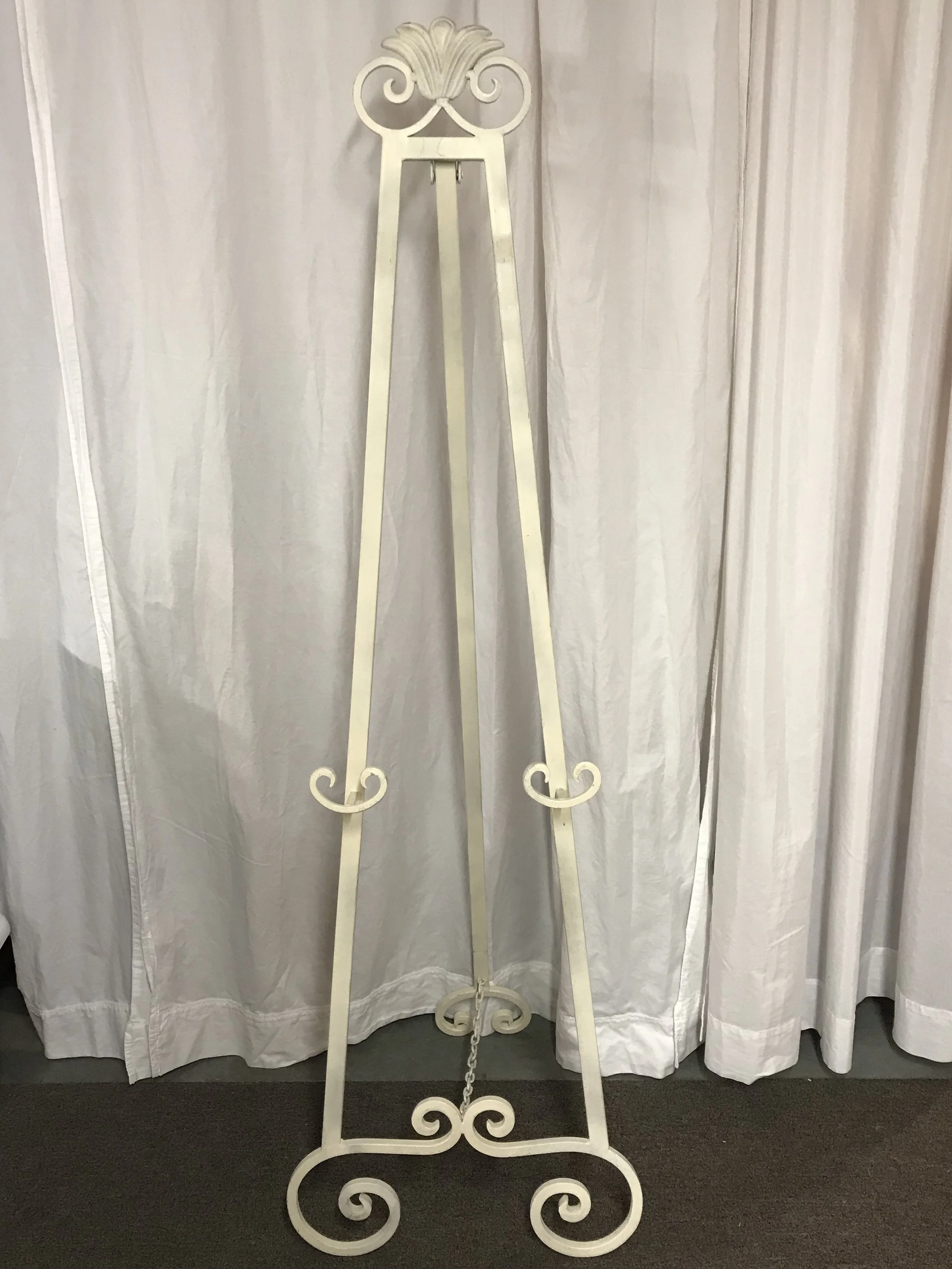 Classic white metal easel for wedding welcome signs and seating charts by Berkshire Event Lighting.