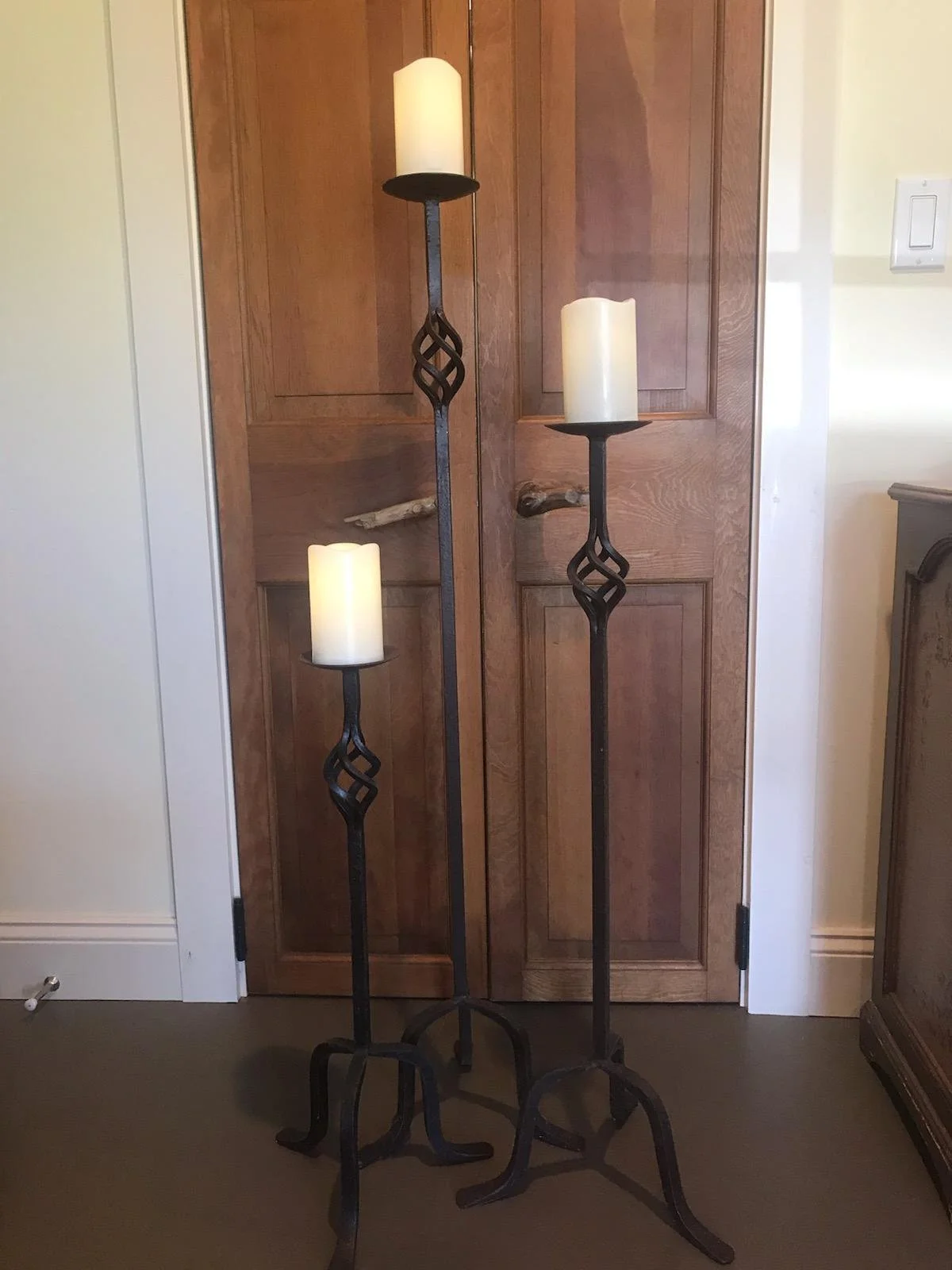 Tall black metal pillar candle holders in three sizes for modern wedding decor by Berkshire Event Lighting