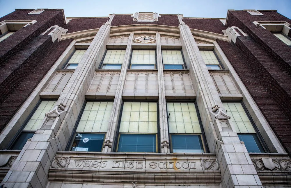 Image of West High School entrance showing top of building.