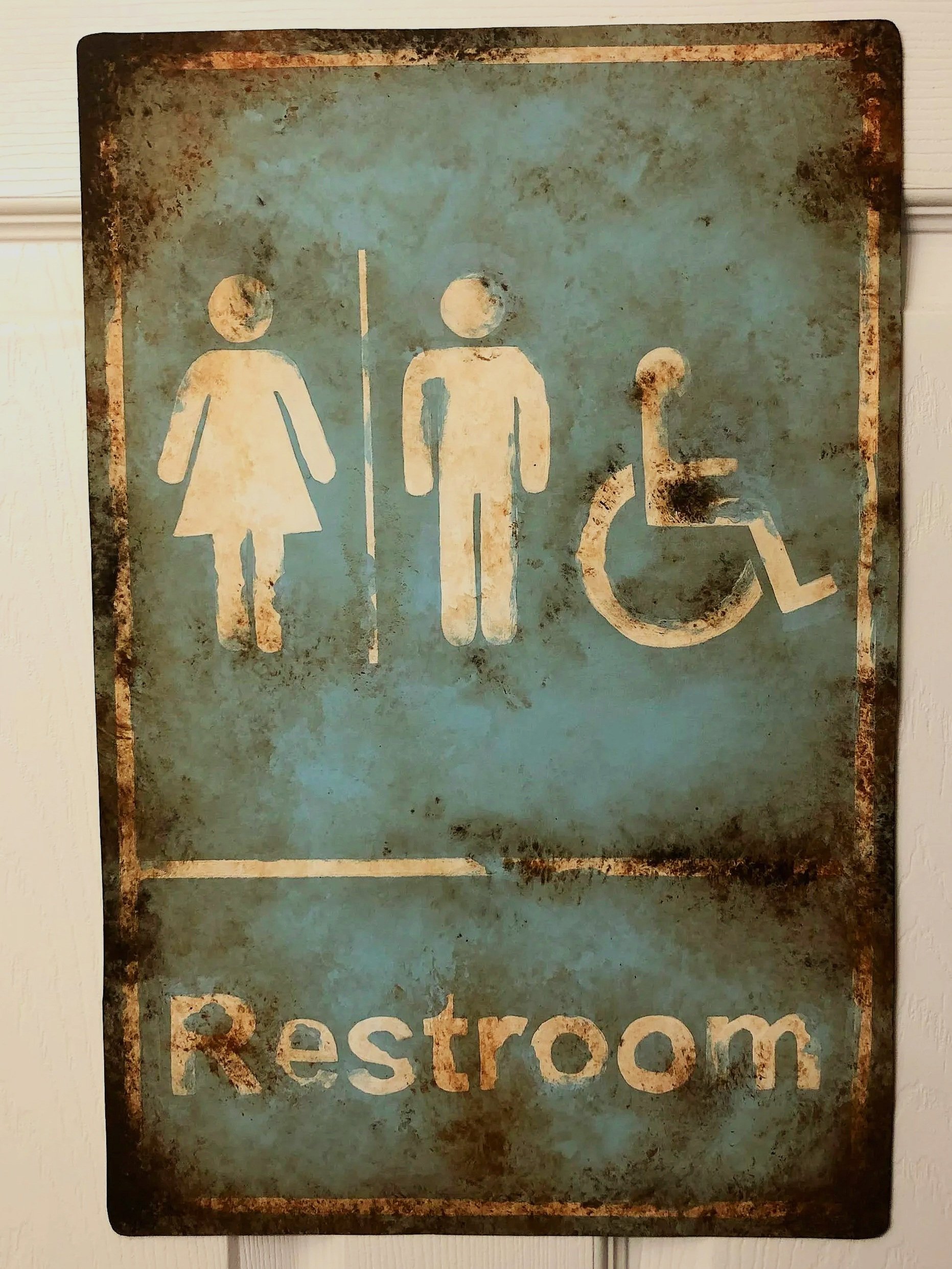 Rusted Restroom Sign on Linoleum (2021)